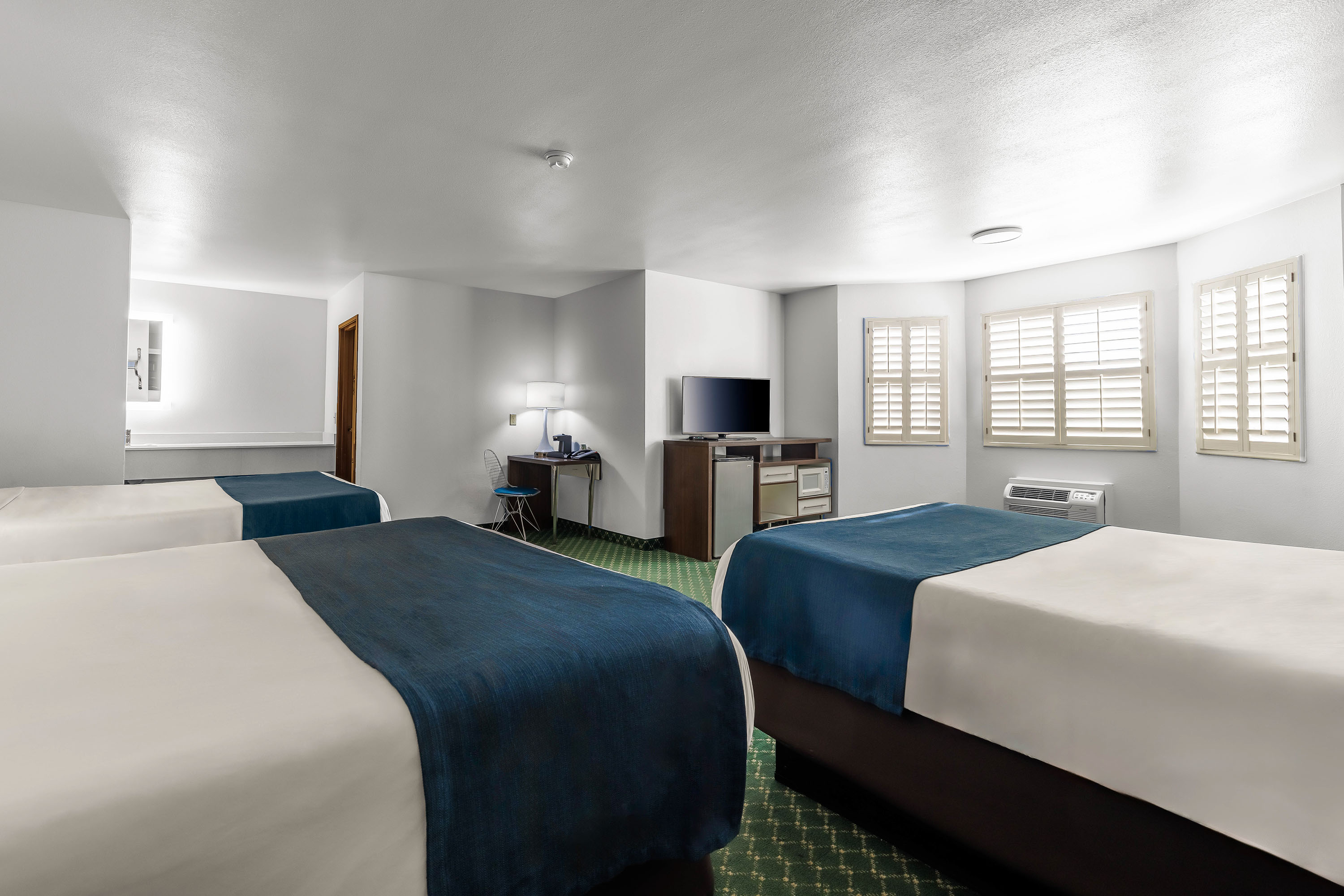 Guest room at the Days Inn & Suites by Wyndham Flagstaff Near University in Flagstaff, Arizona