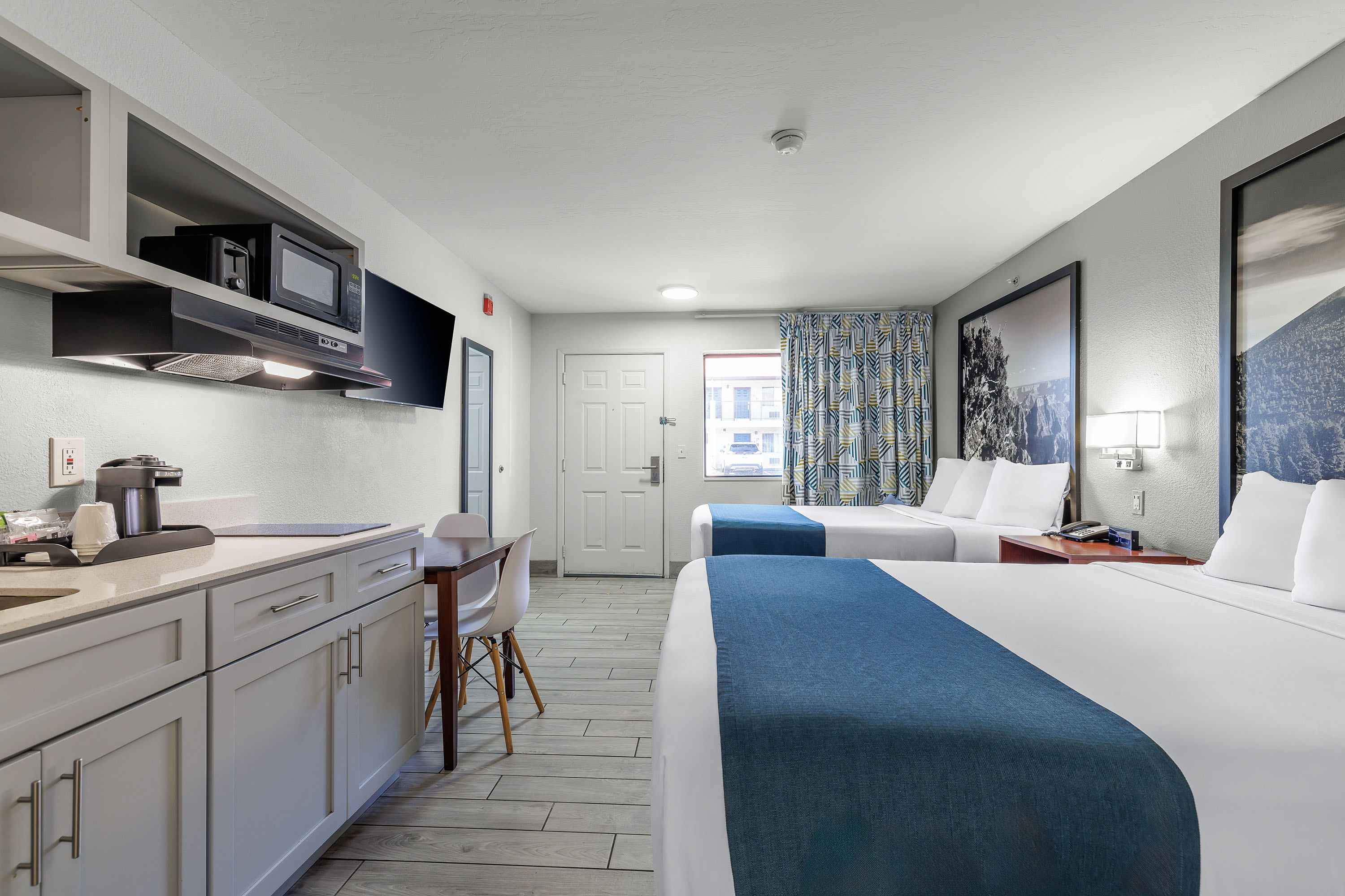 Guest room at the Days Inn & Suites by Wyndham Flagstaff Near University in Flagstaff, Arizona