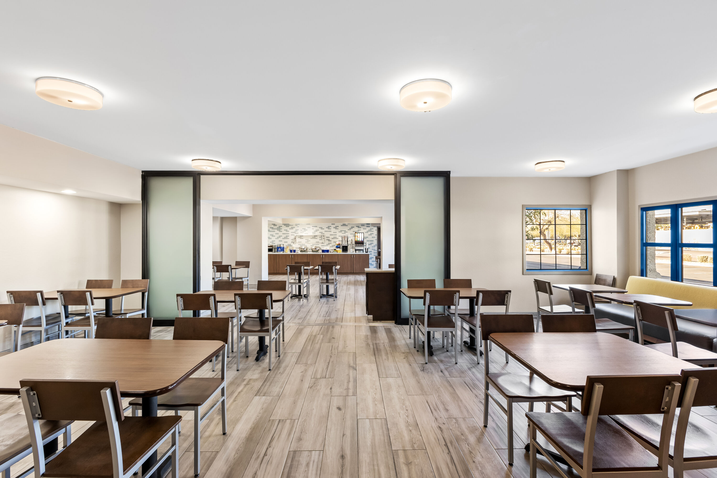 Days Inn & Suites by Wyndham Mesa Near Phoenix restaurant breakfast area with seating in Mesa, Arizona