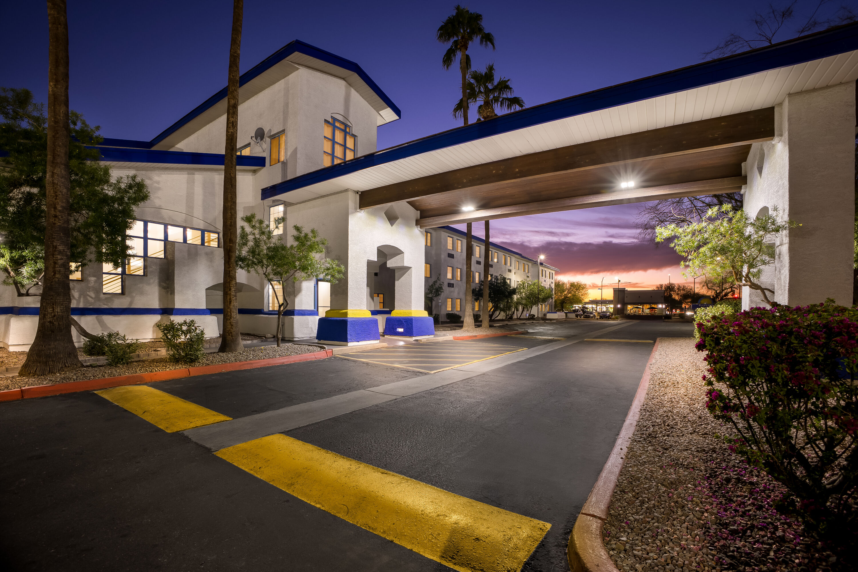 Exterior Night Image of Days Inn & Suites by Wyndham Mesa Near Phoenix hotel in Mesa, Arizona