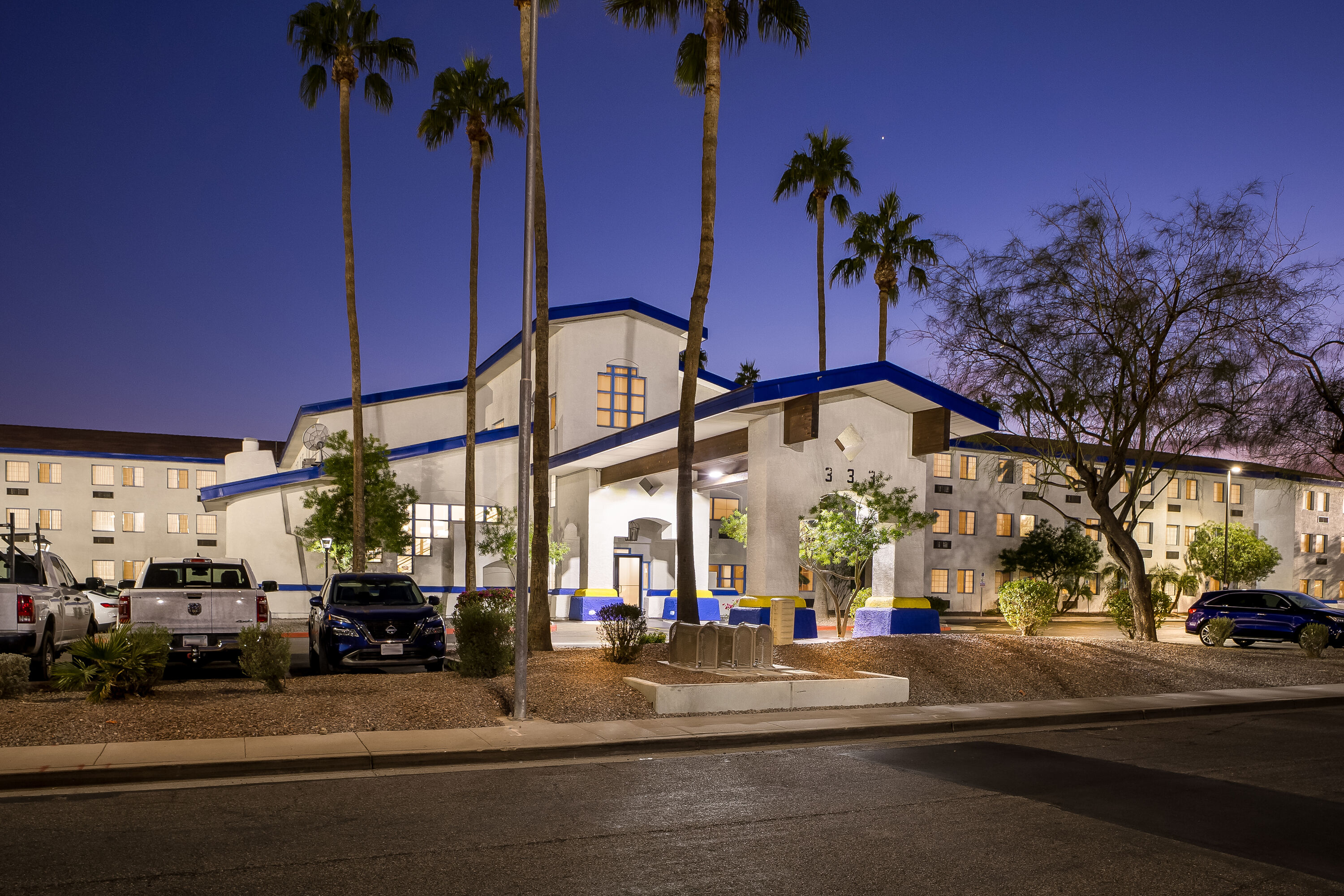 Exterior Night Image of Days Inn & Suites by Wyndham Mesa Near Phoenix hotel in Mesa, Arizona