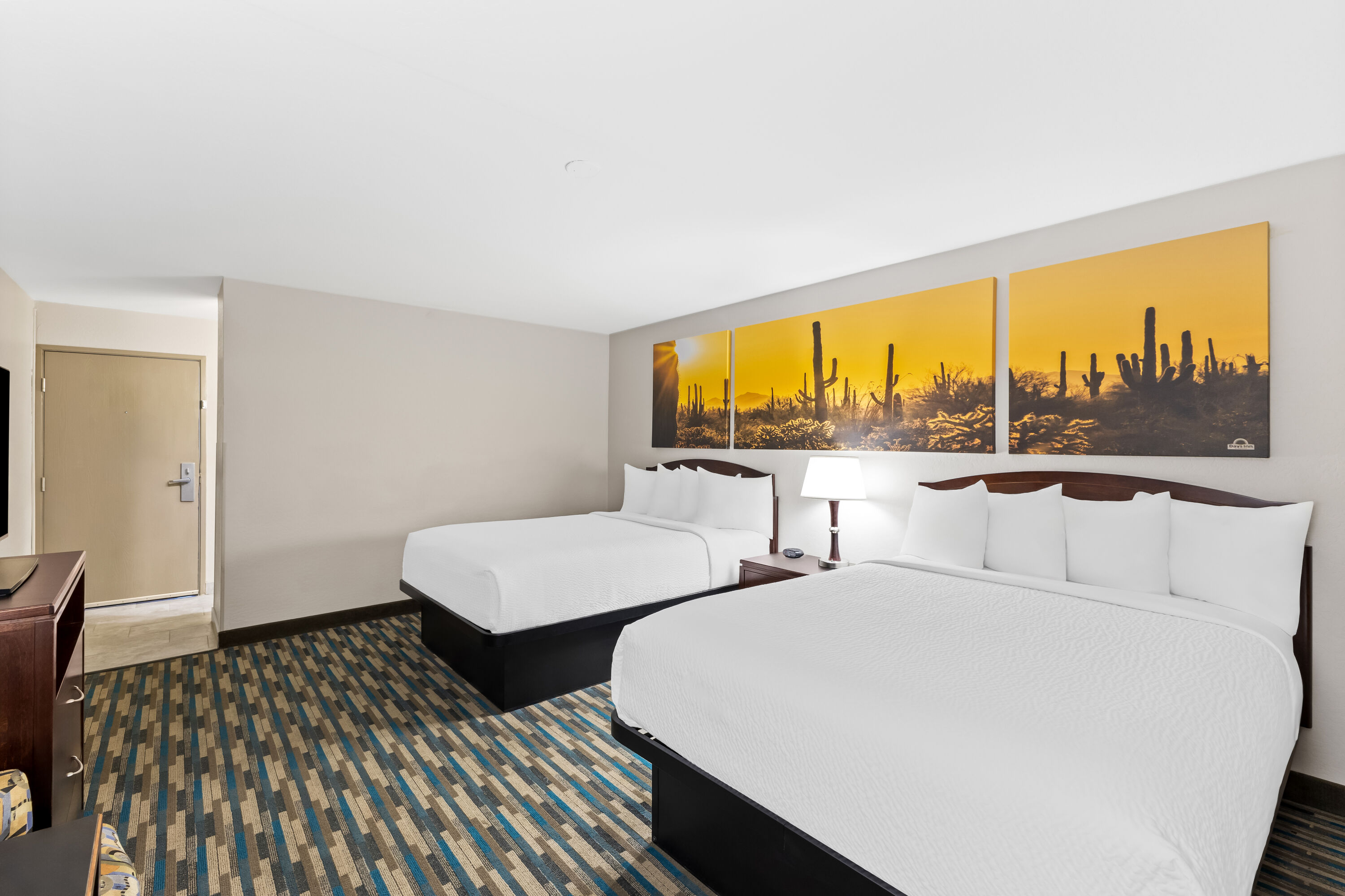 Double bed guest room at the Days Inn & Suites by Wyndham Mesa Near Phoenix in Mesa, Arizona