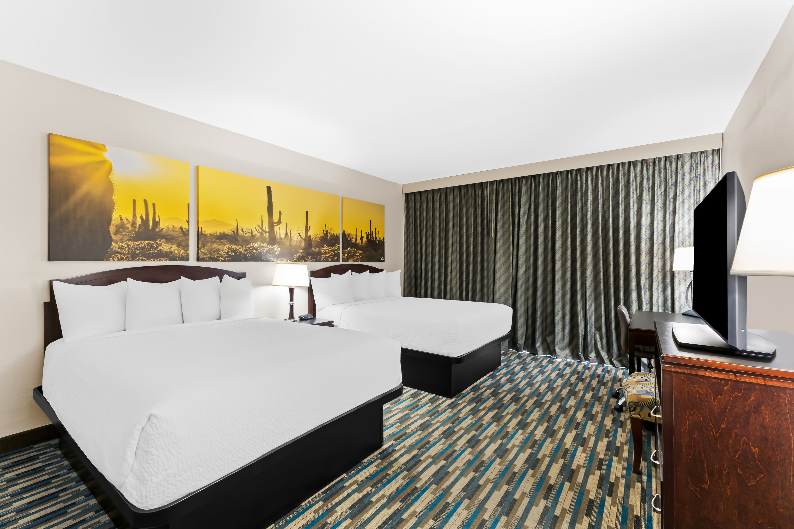 Double bed guest room at the Days Inn & Suites by Wyndham Mesa Near Phoenix in Mesa, Arizona