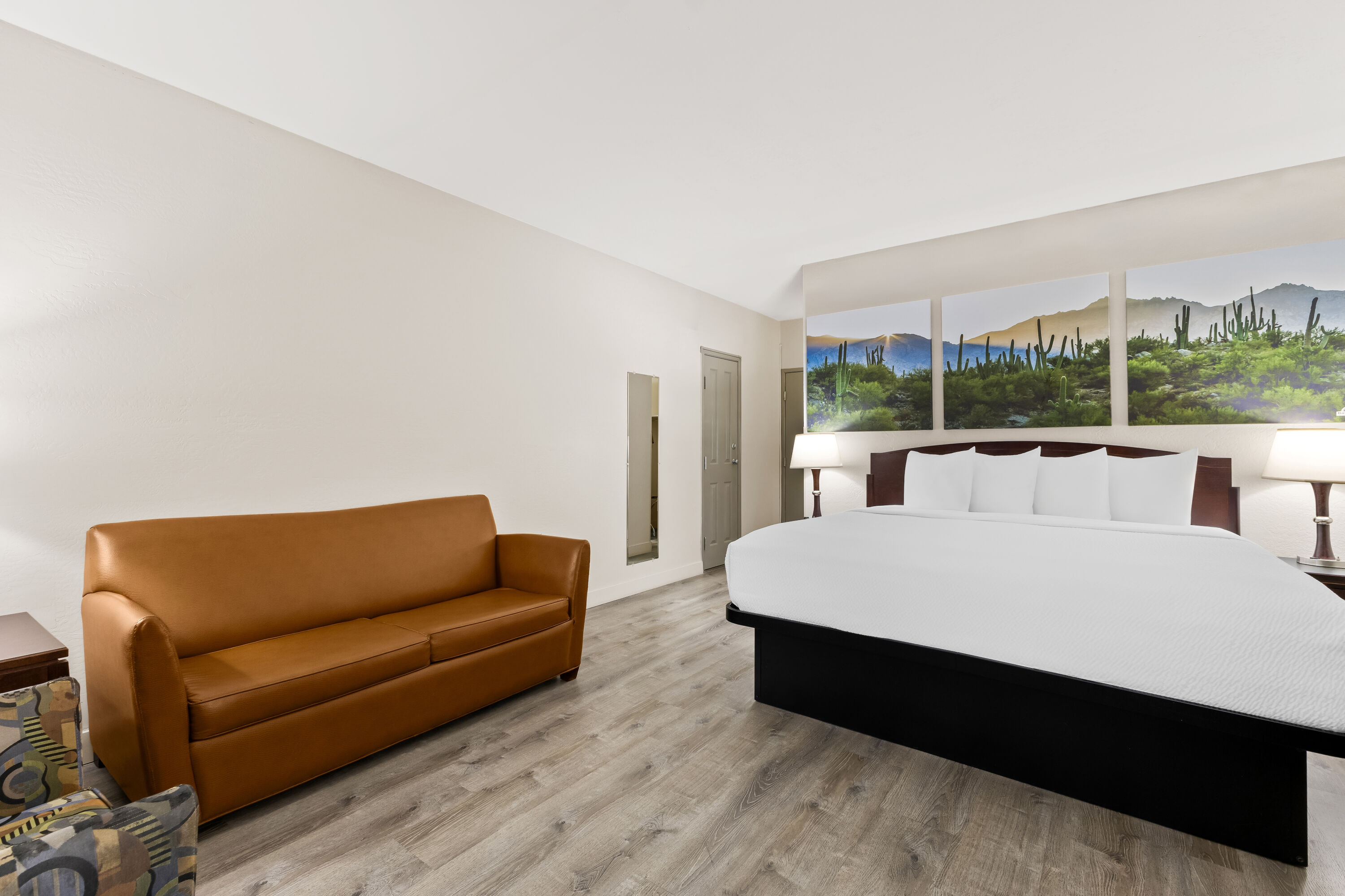 King bed guest room at the Days Inn & Suites by Wyndham Mesa Near Phoenix in Mesa, Arizona