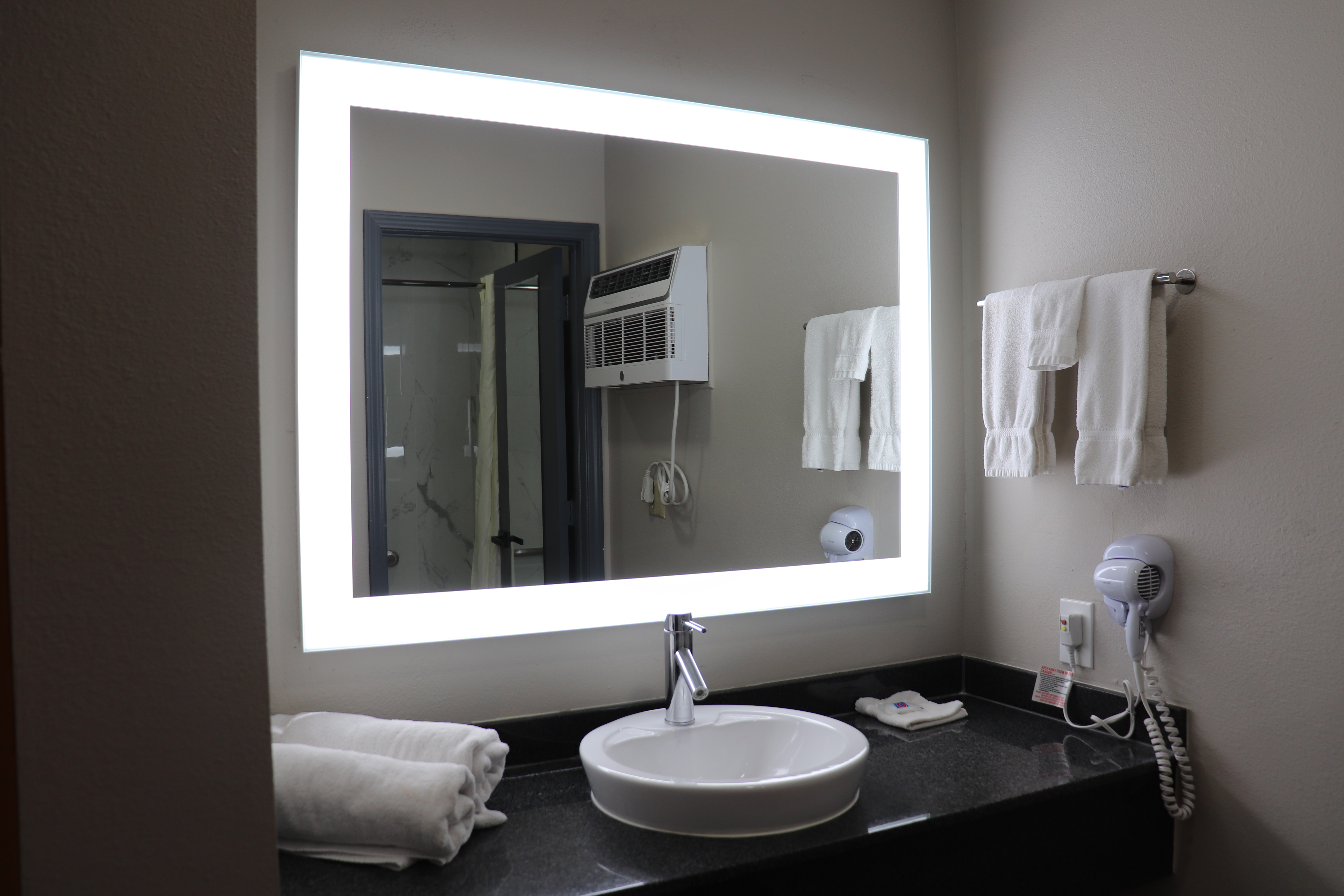 Guest room bath at the Days Inn by Wyndham Payson in Payson, Arizona