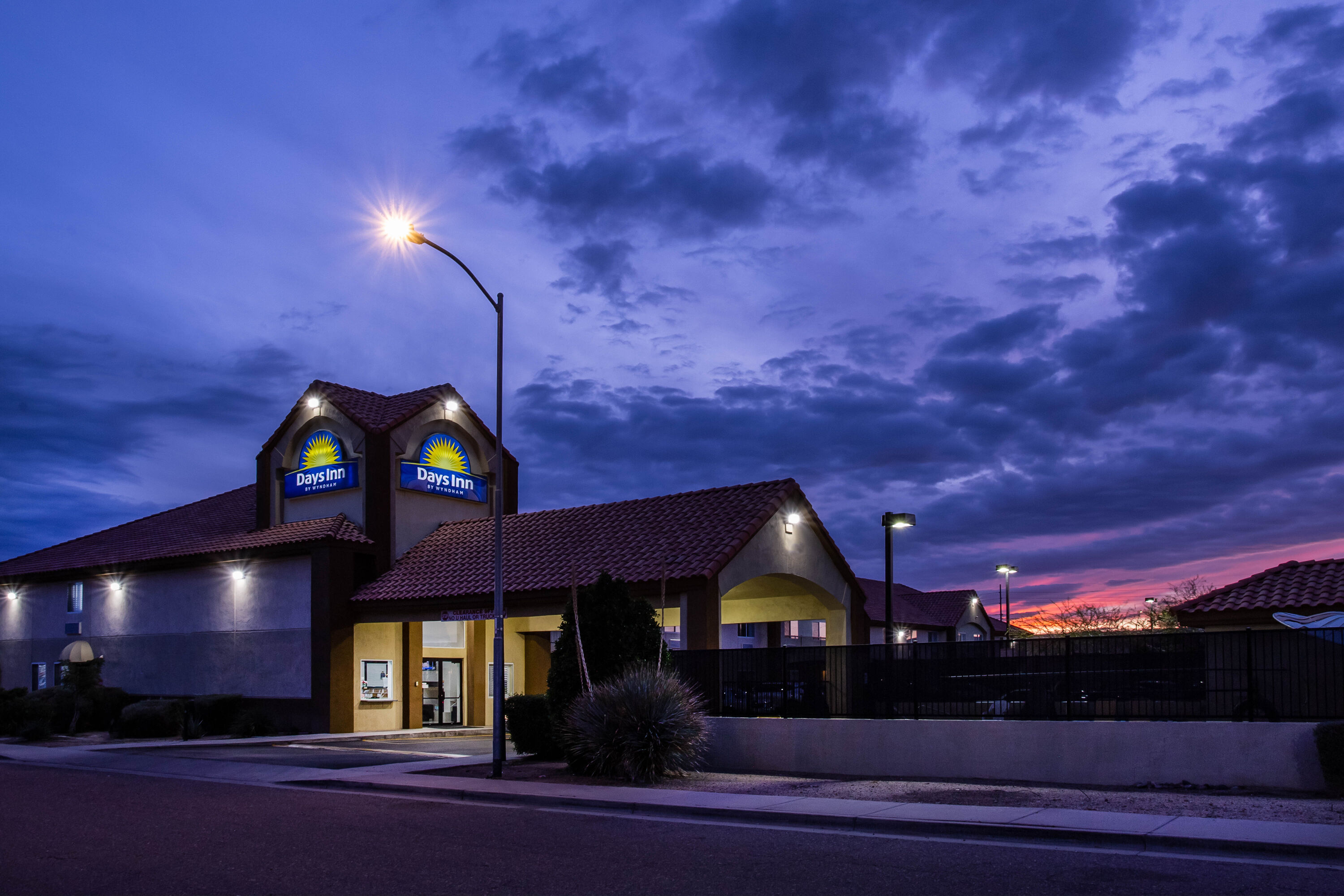 Exterior Night Image of Days Inn by Wyndham Phoenix North hotel in Phoenix, Arizona