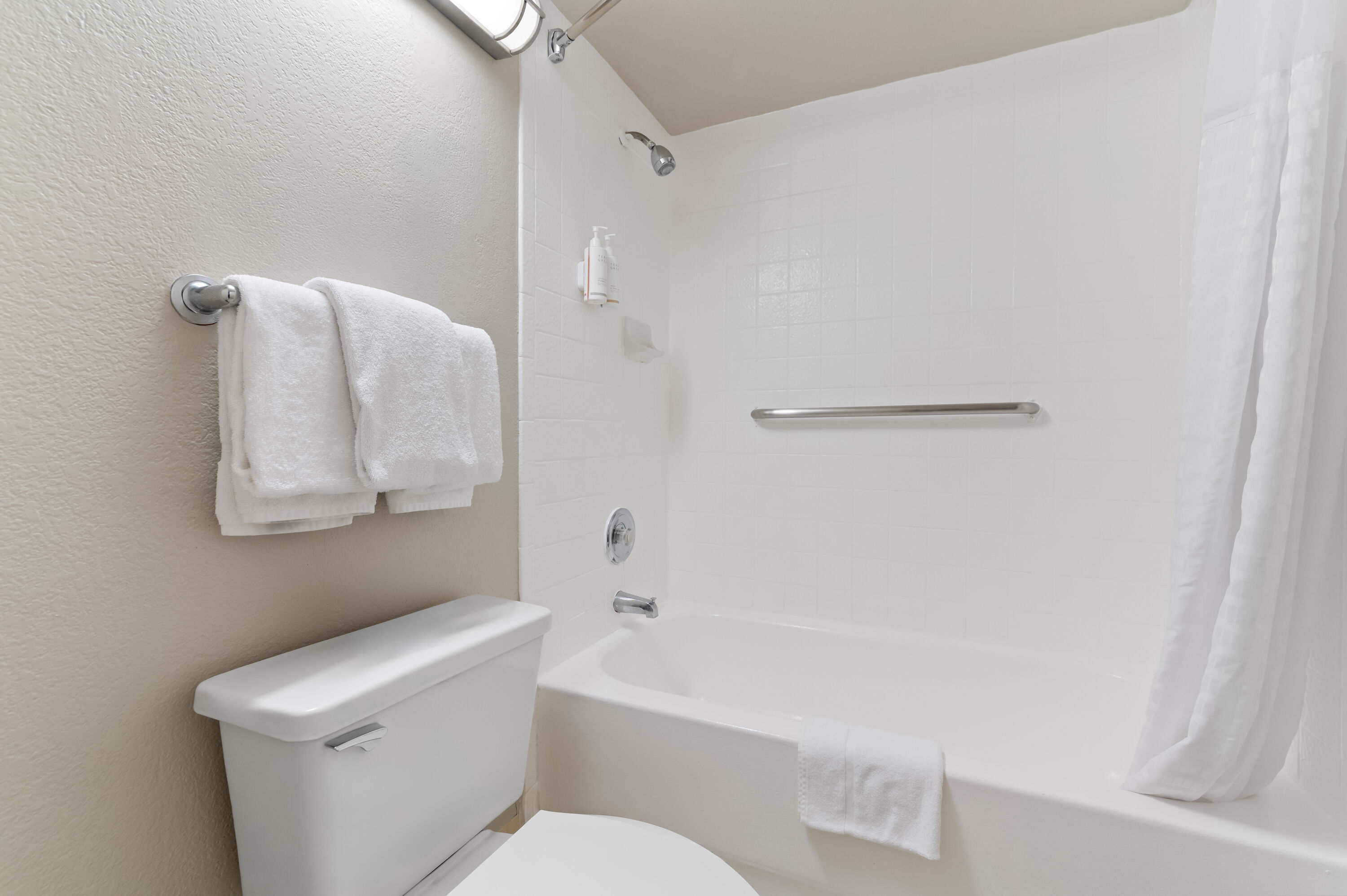 Guest room bath at the Days Inn by Wyndham Buena Park in Buena Park, California