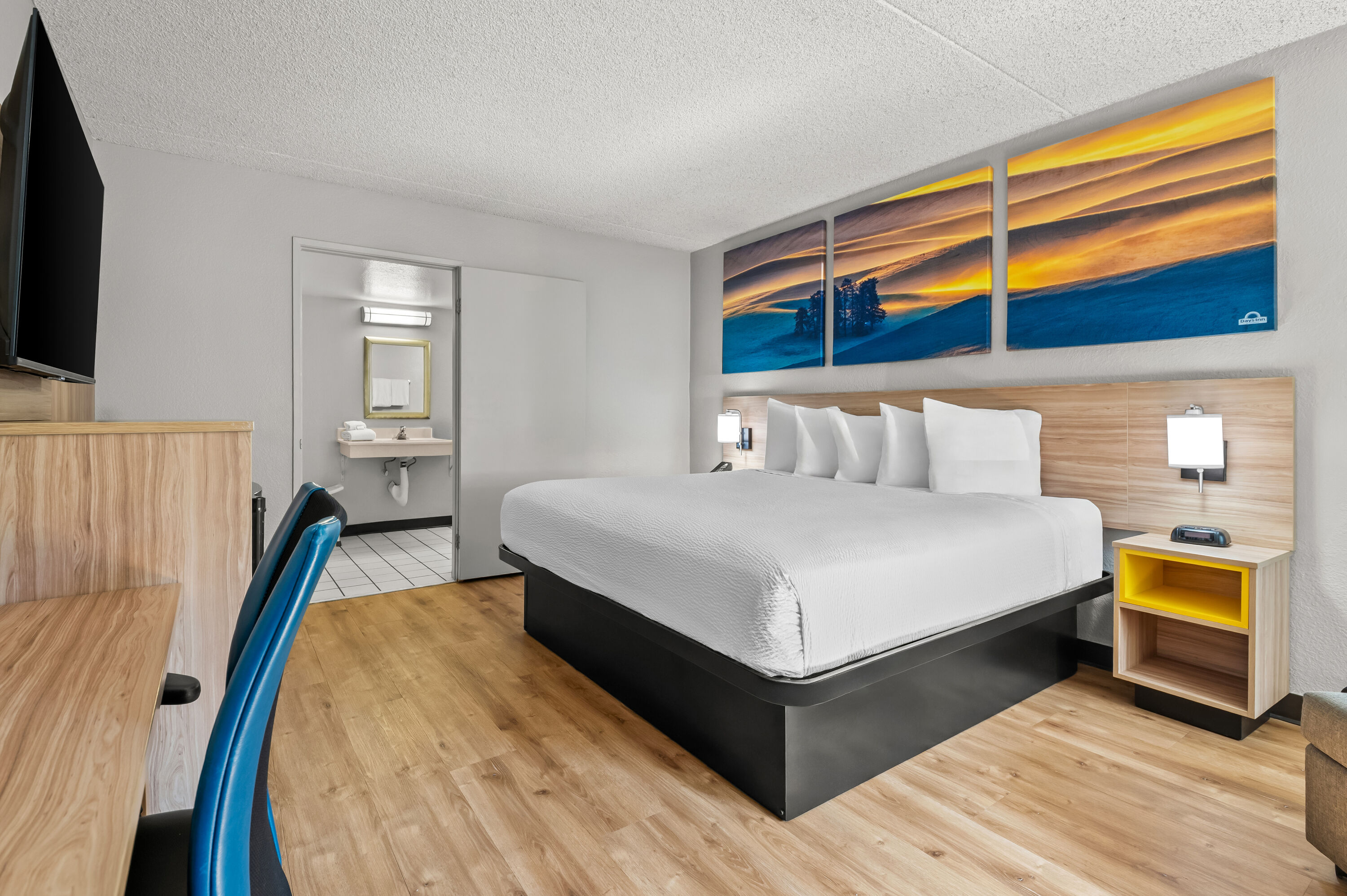 King bed guest room at the Days Inn by Wyndham Buena Park in Buena Park, California