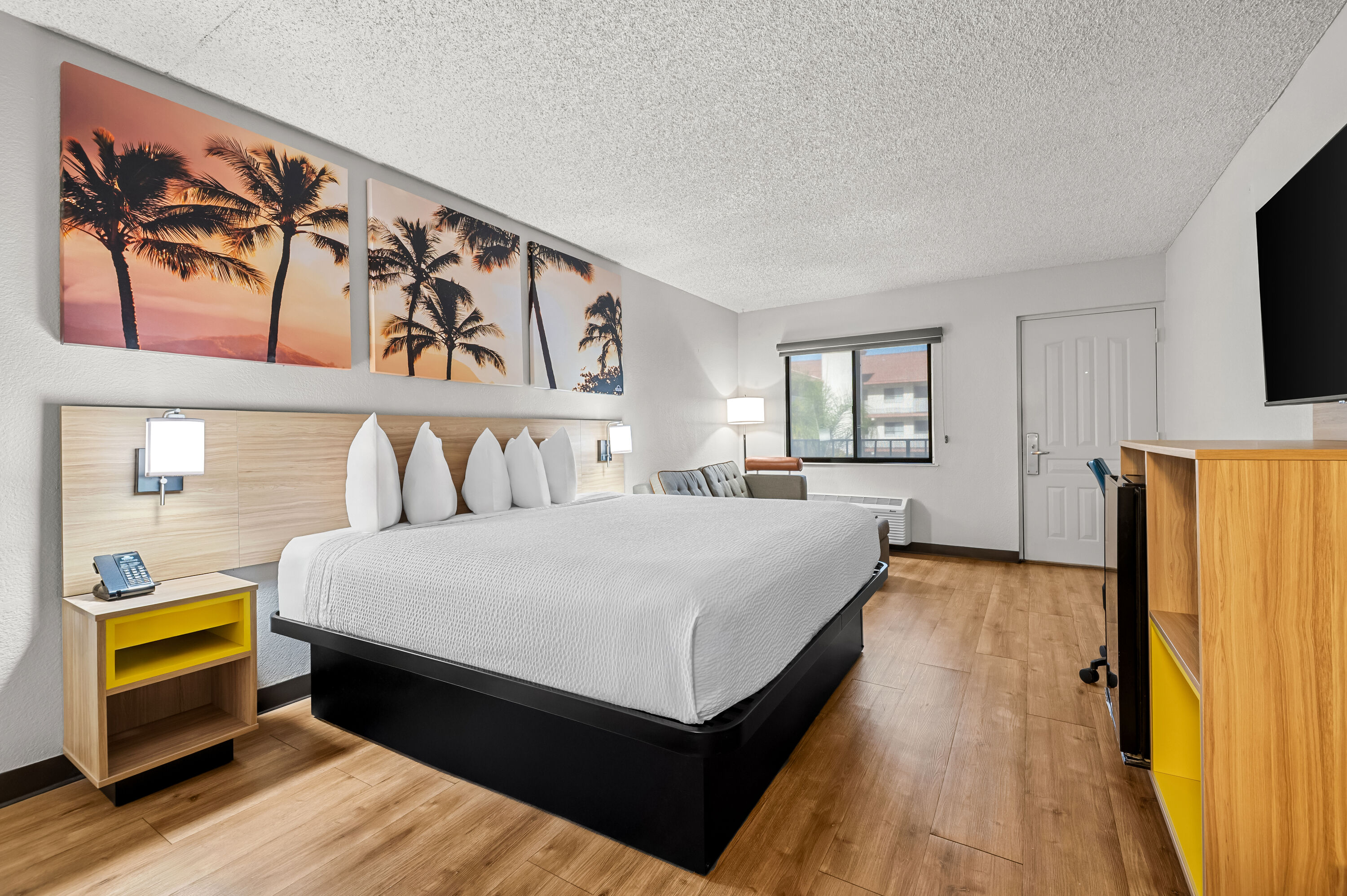 King bed guest room at the Days Inn by Wyndham Buena Park in Buena Park, California