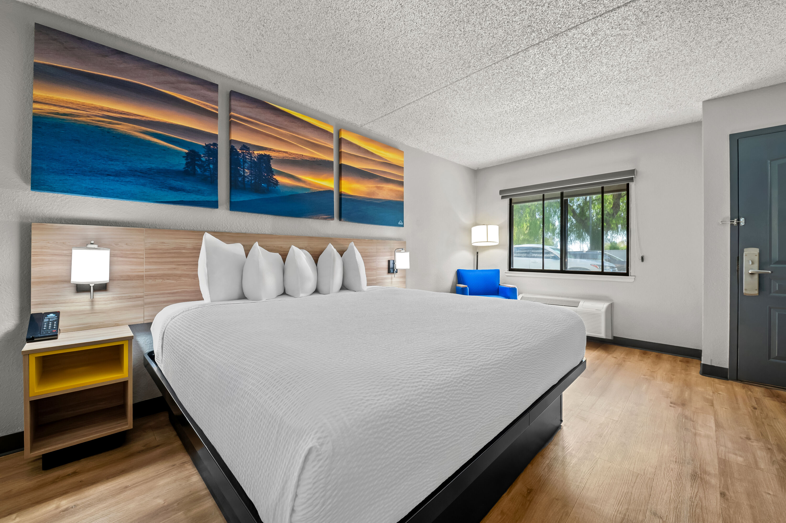 King bed guest room at the Days Inn by Wyndham Buena Park in Buena Park, California