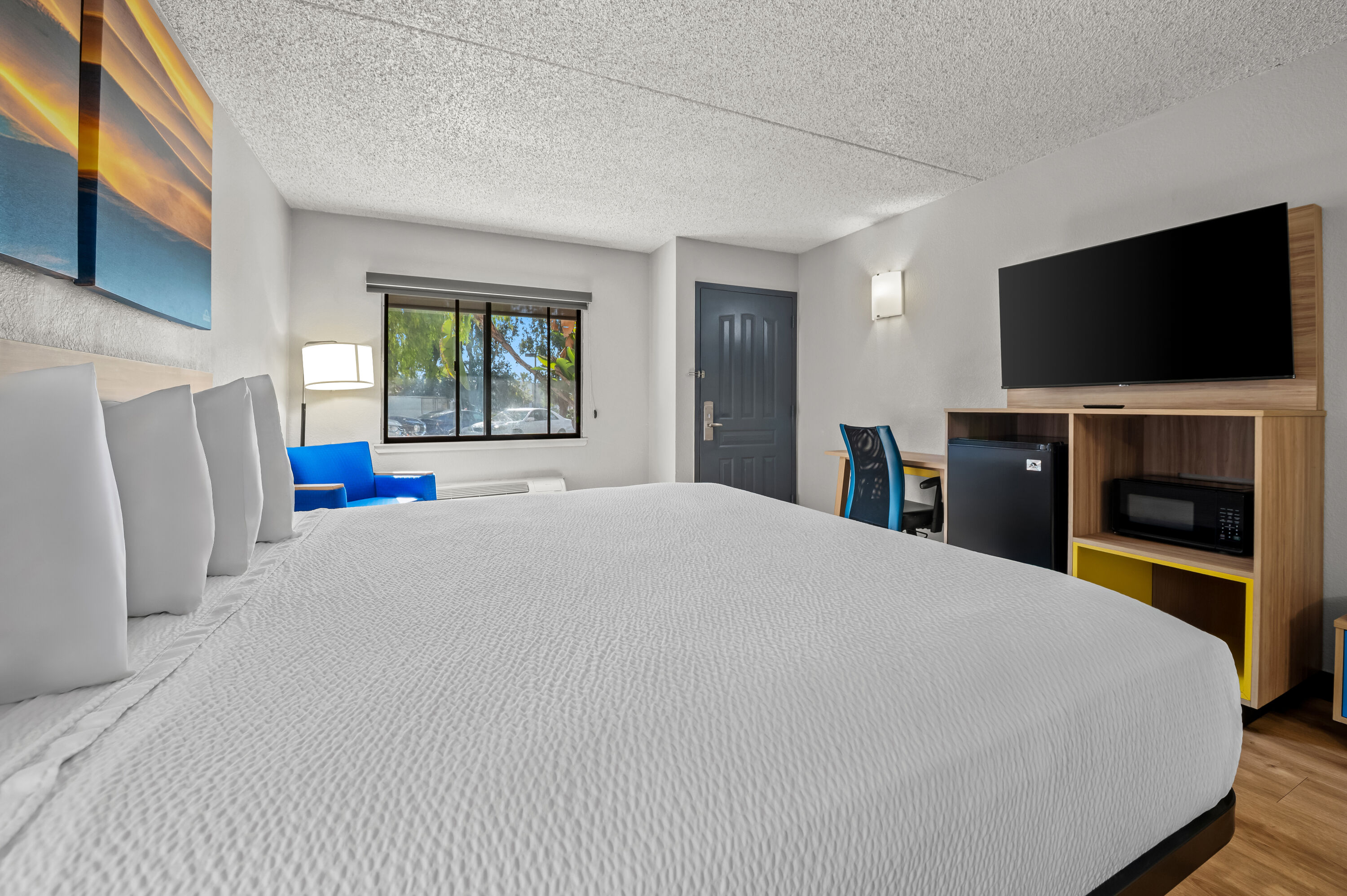 King bed guest room at the Days Inn by Wyndham Buena Park in Buena Park, California