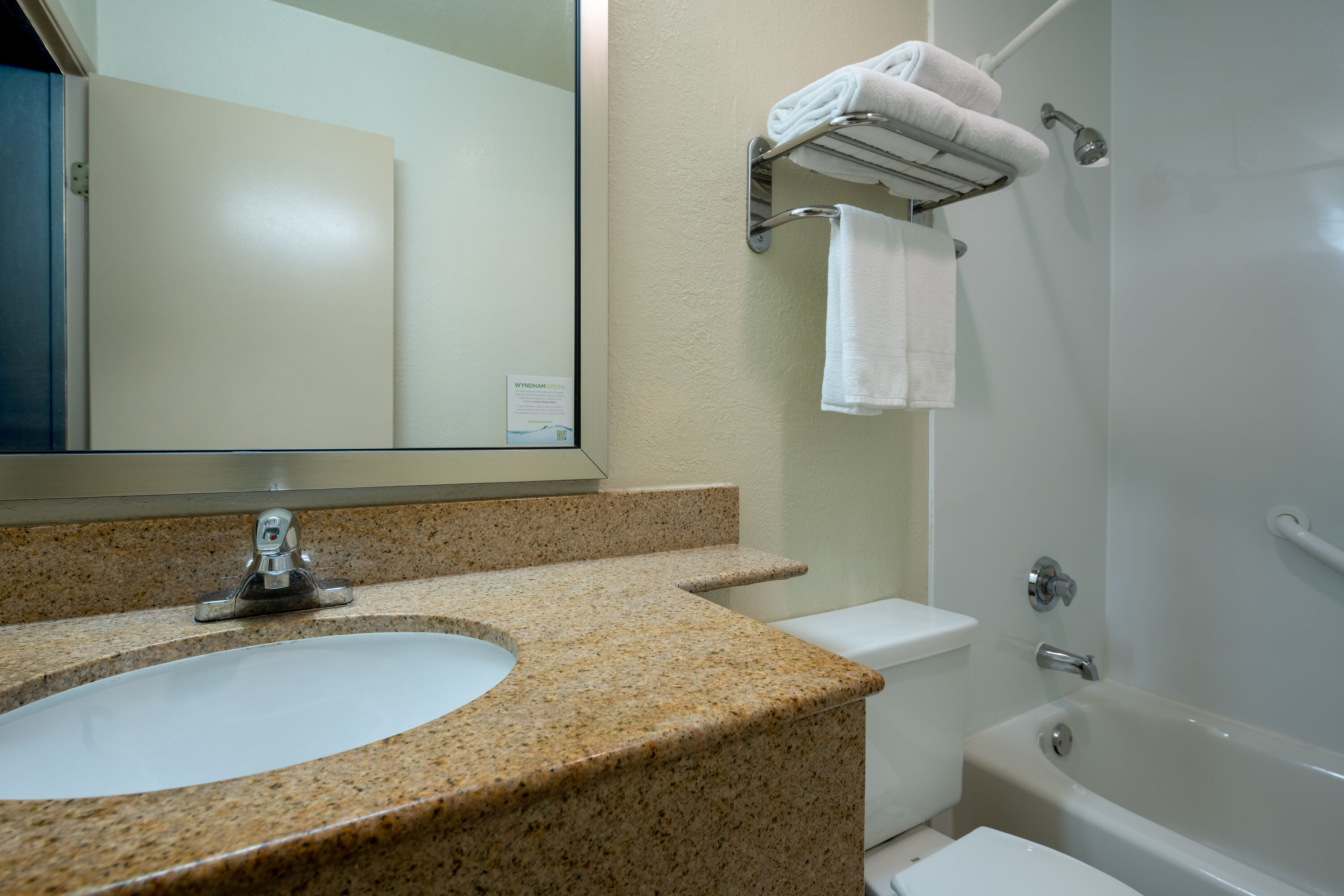 Guest room bath at the Days Inn by Wyndham Encinitas Moonlight Beach in Encinitas, California