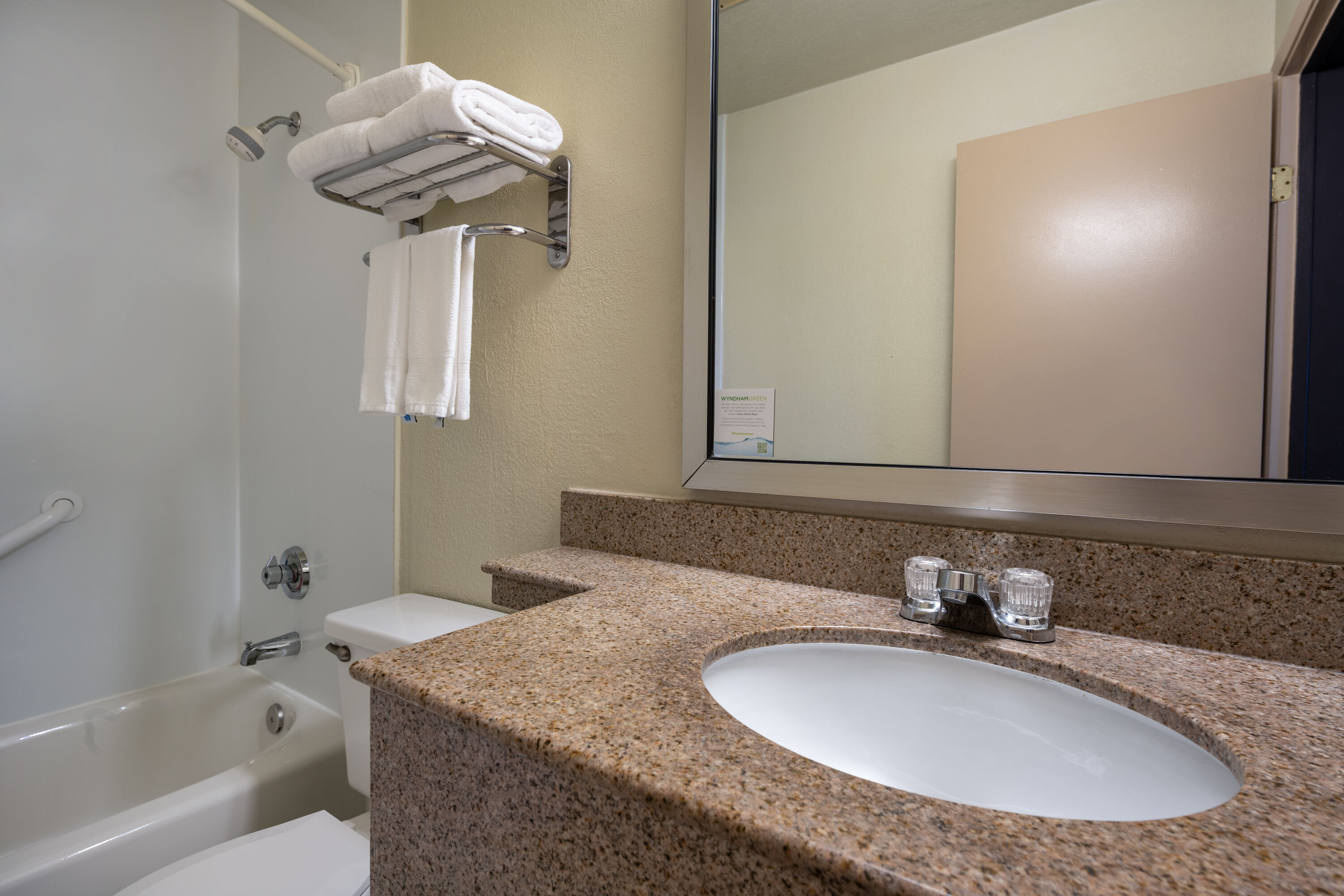 Guest room bath at the Days Inn by Wyndham Encinitas Moonlight Beach in Encinitas, California