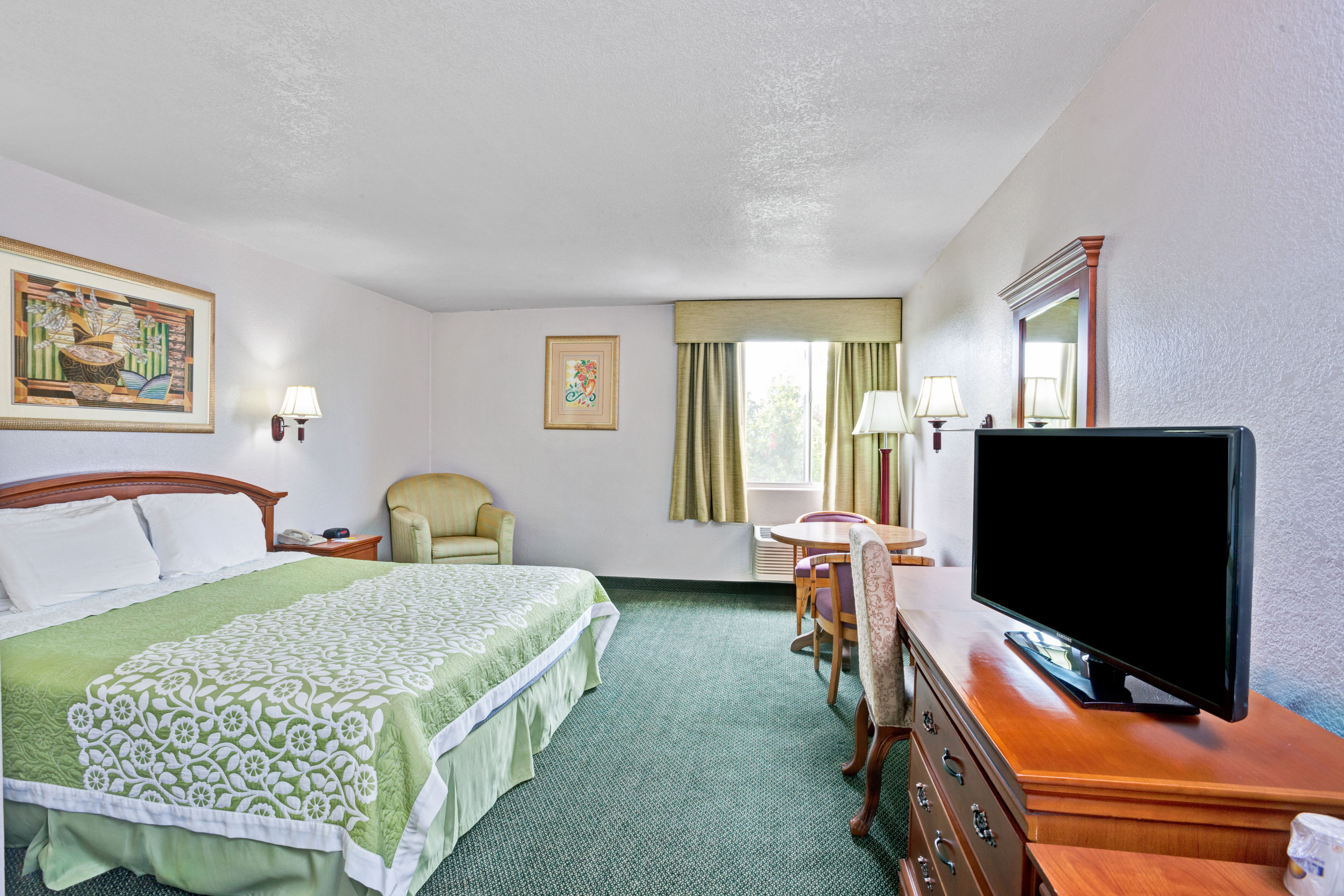 Guest room at the Days Inn & Suites by Wyndham Fullerton in Fullerton, California