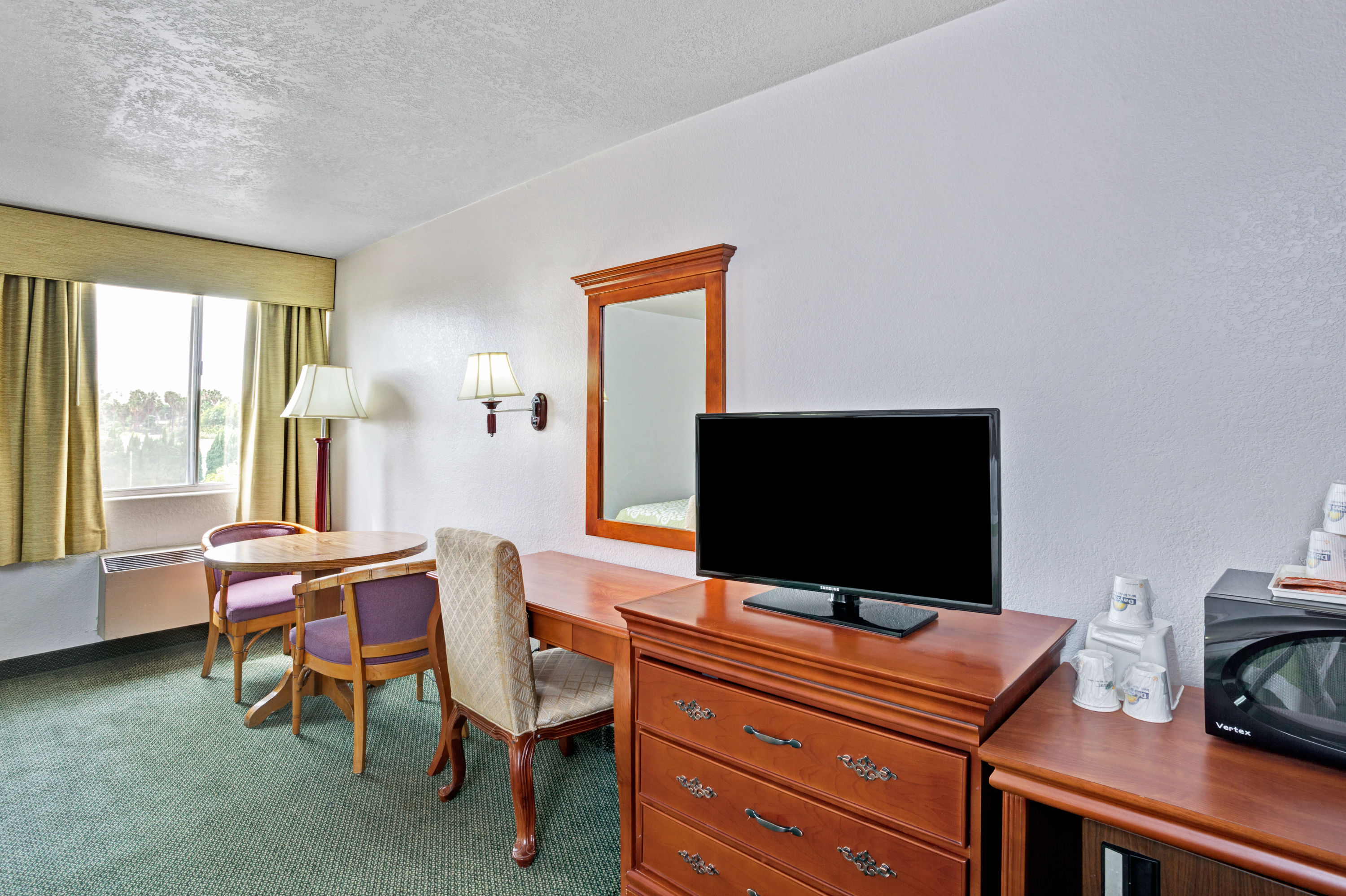 Guest room at the Days Inn & Suites by Wyndham Fullerton in Fullerton, California