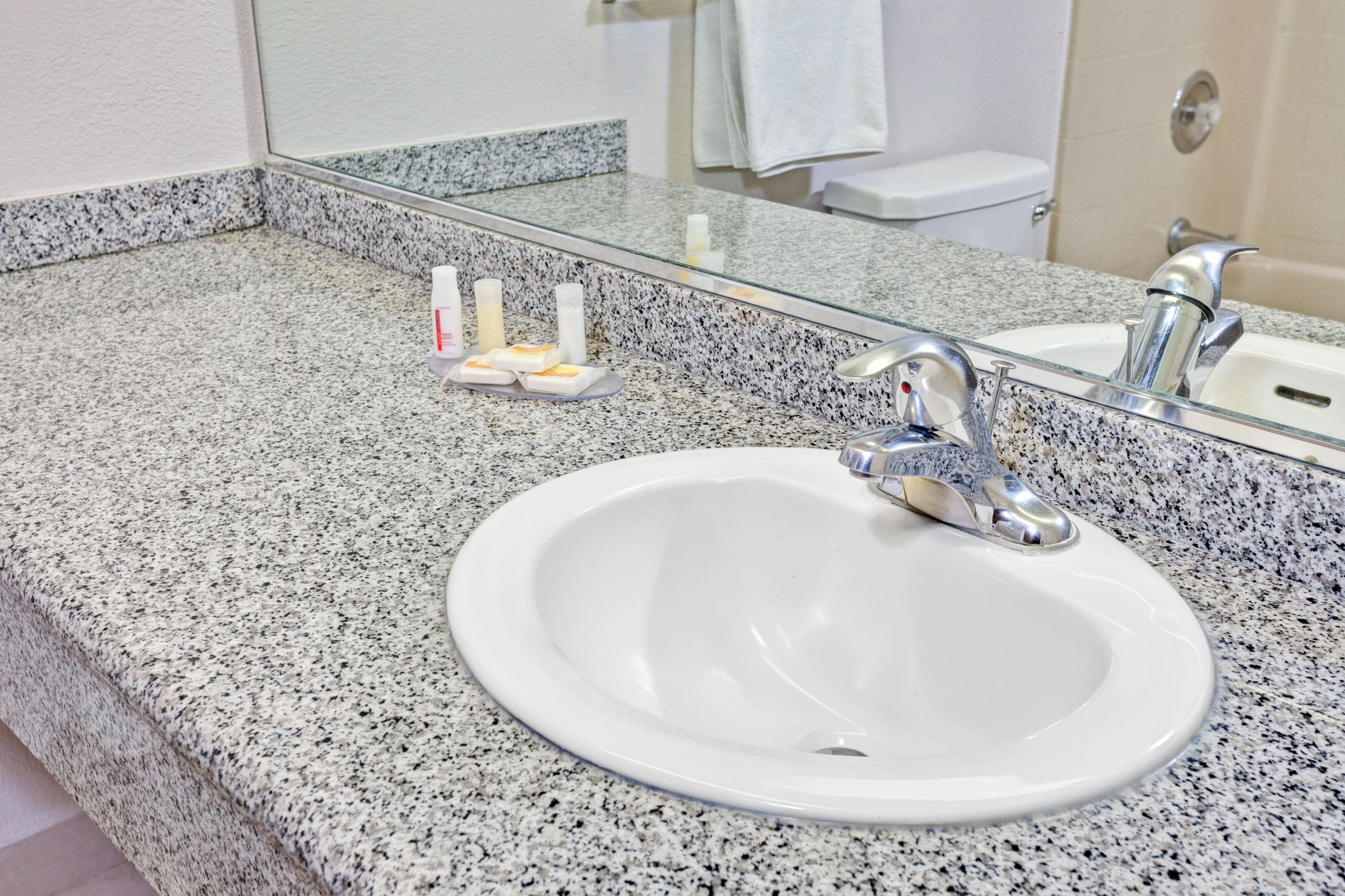 Guest room at the Days Inn & Suites by Wyndham Fullerton in Fullerton, California