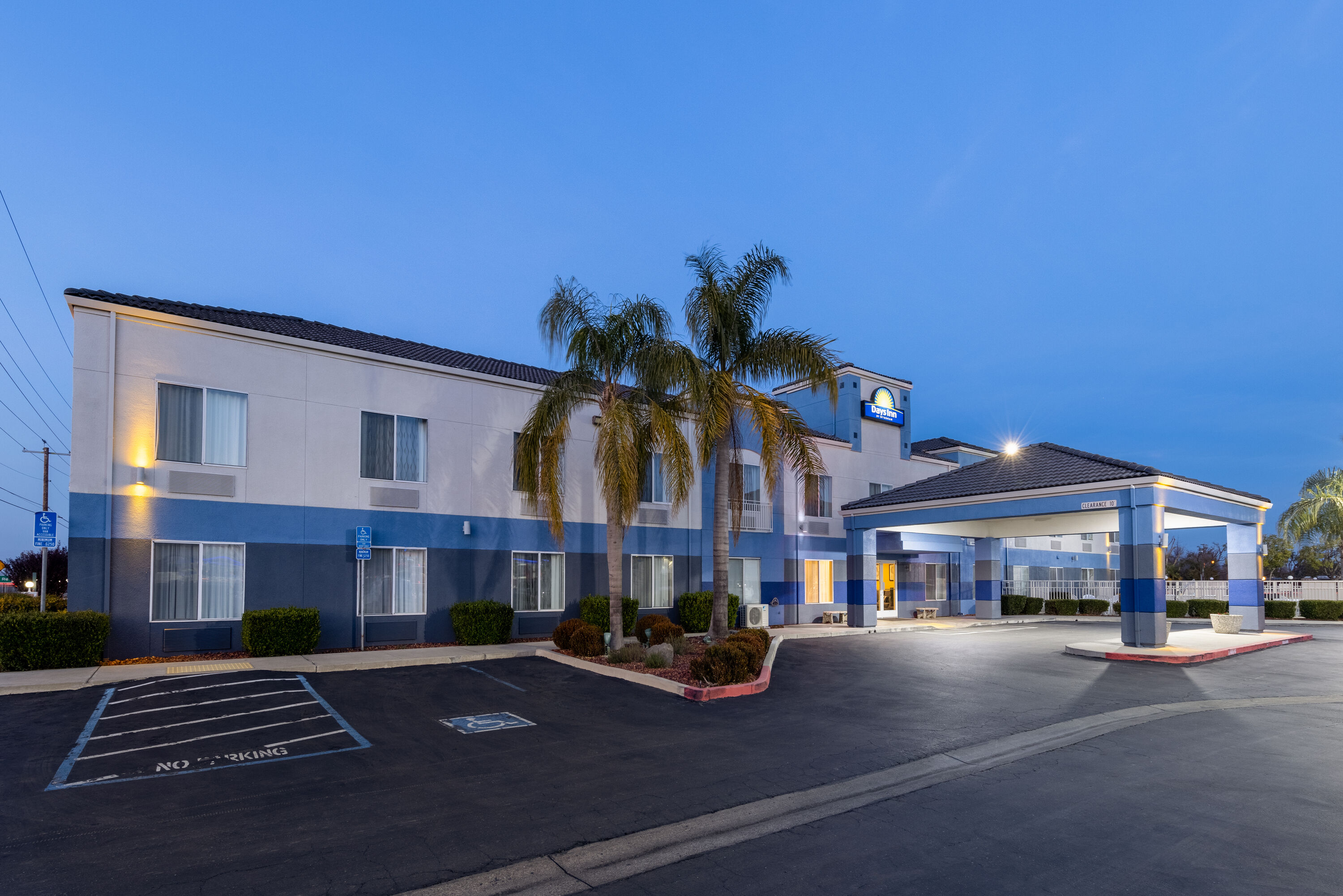 Exterior Dusk Image of Days Inn by Wyndham Lathrop hotel in Lathrop, California