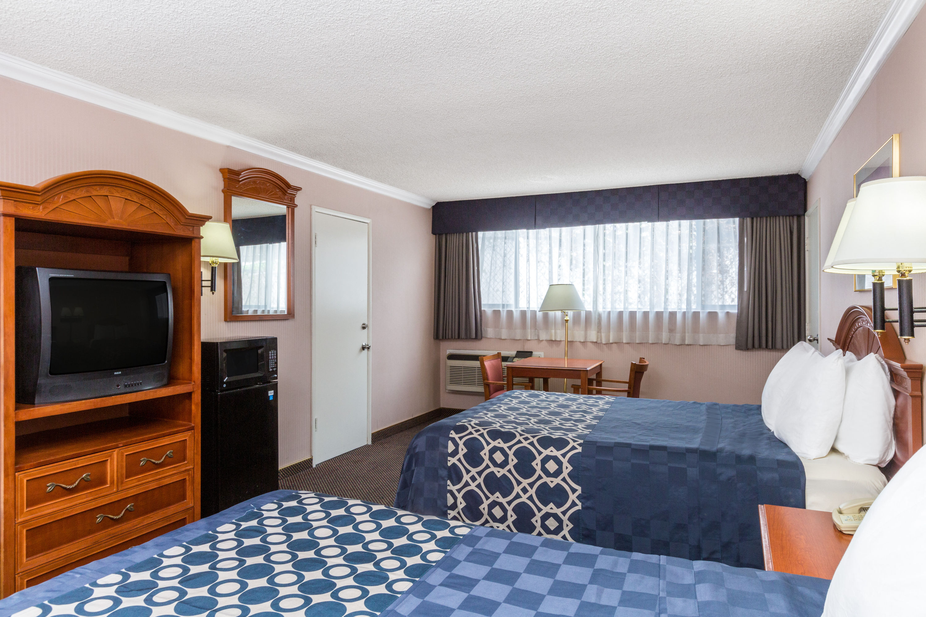 Guest room at the Days Inn by Wyndham Los Angeles Stadium Area/LAX in Los Angeles, California
