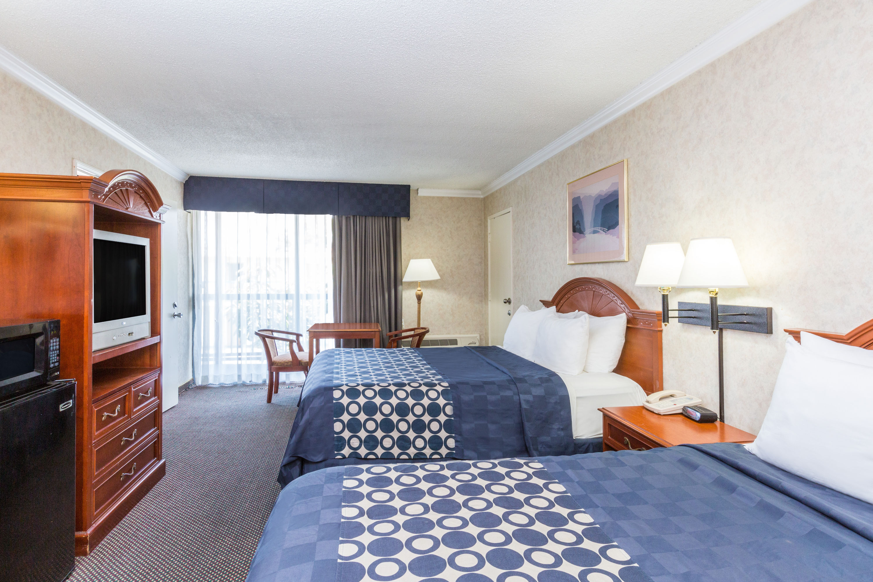 Guest room at the Days Inn by Wyndham Los Angeles Stadium Area/LAX in Los Angeles, California