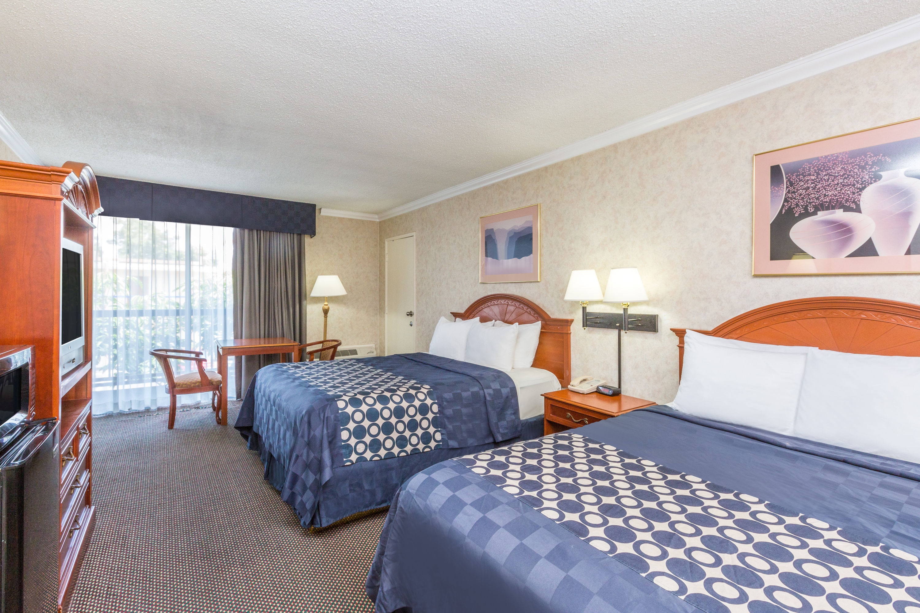 Guest room at the Days Inn by Wyndham Los Angeles Stadium Area/LAX in Los Angeles, California
