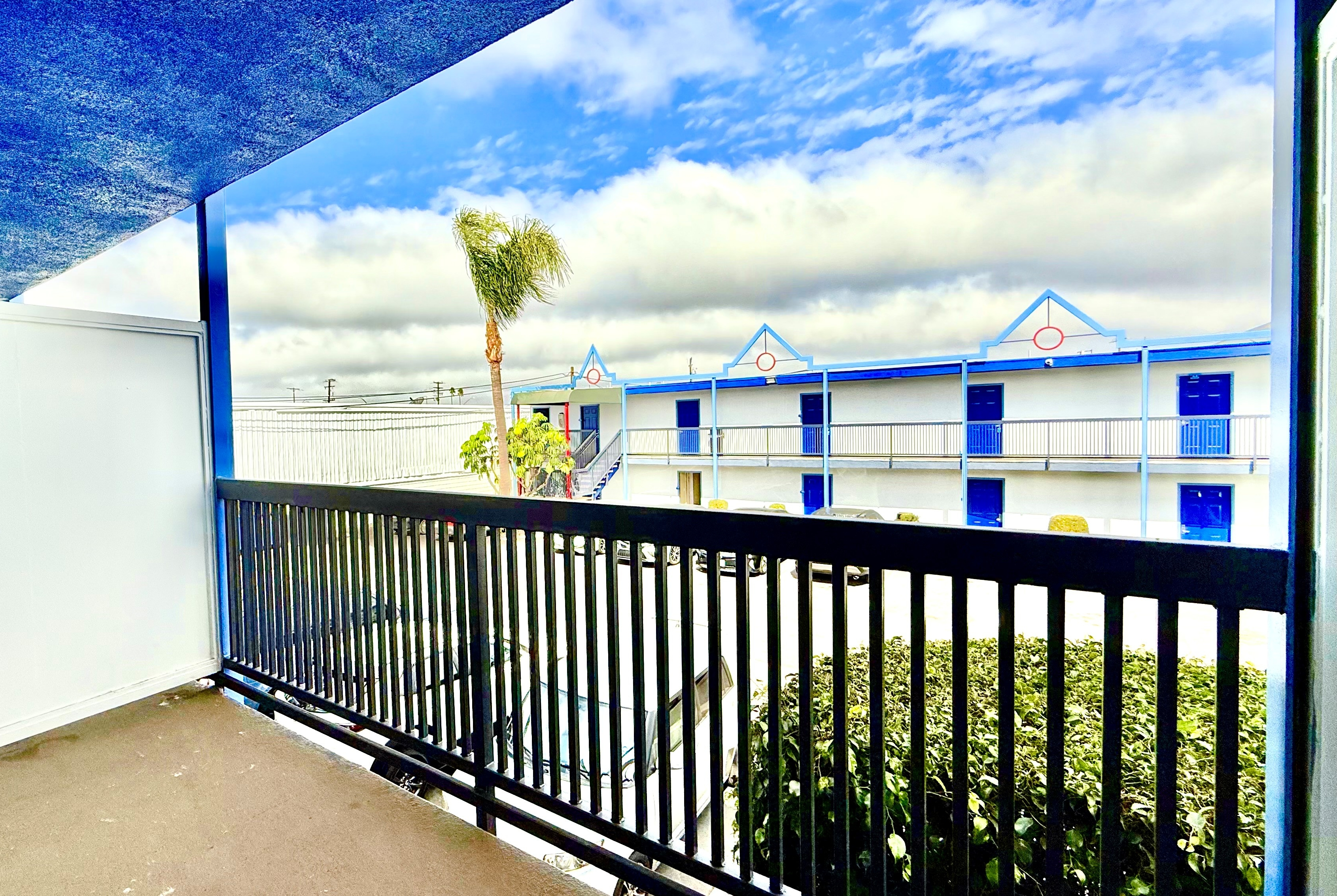 Guest room balcony at Days Inn by Wyndham Los Angeles LAX Airport/Stadium Area in Los Angeles, California