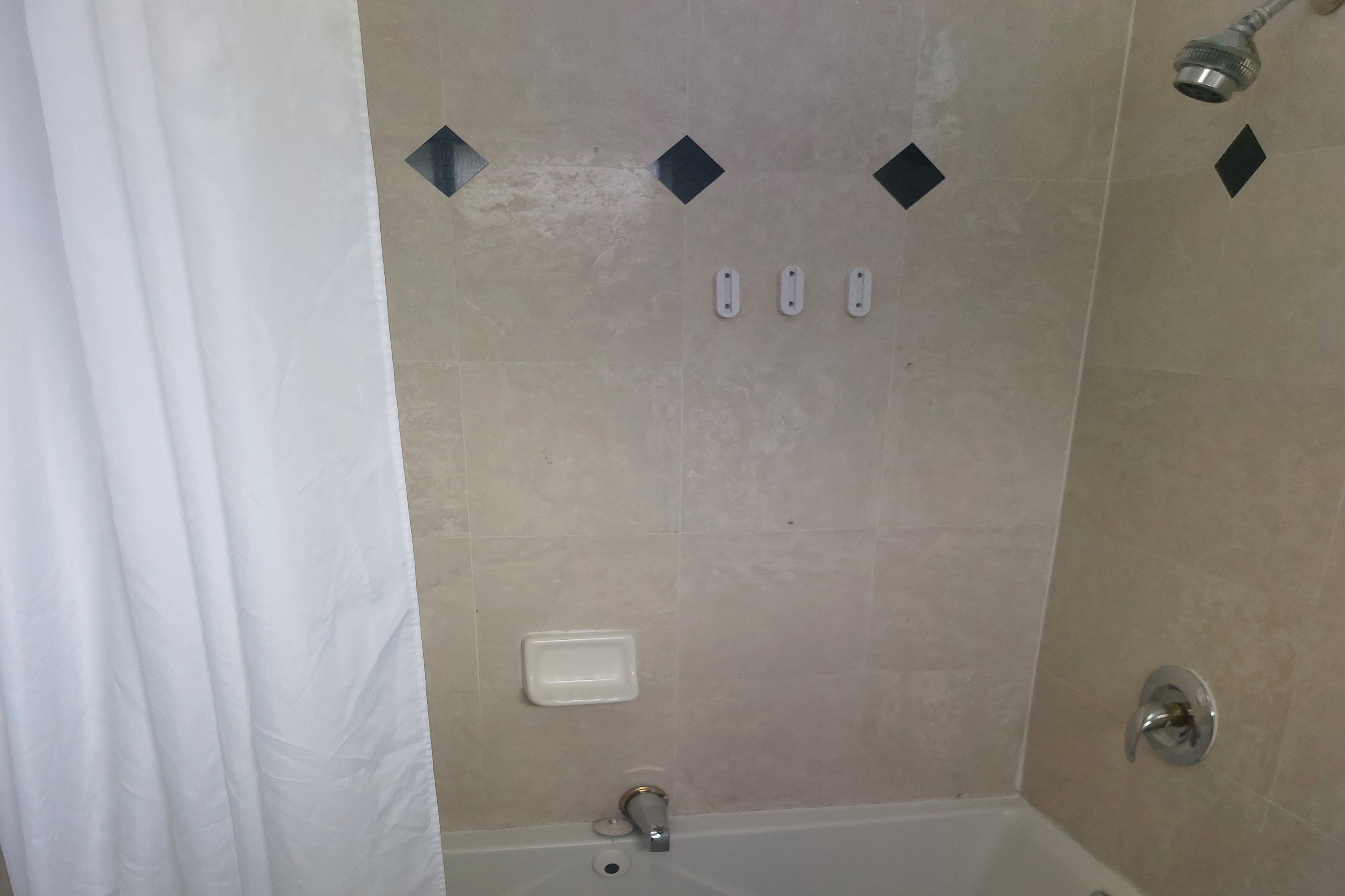 Guest room bath at the Days Inn & Suites by Wyndham Mountain View in Mountain View, California