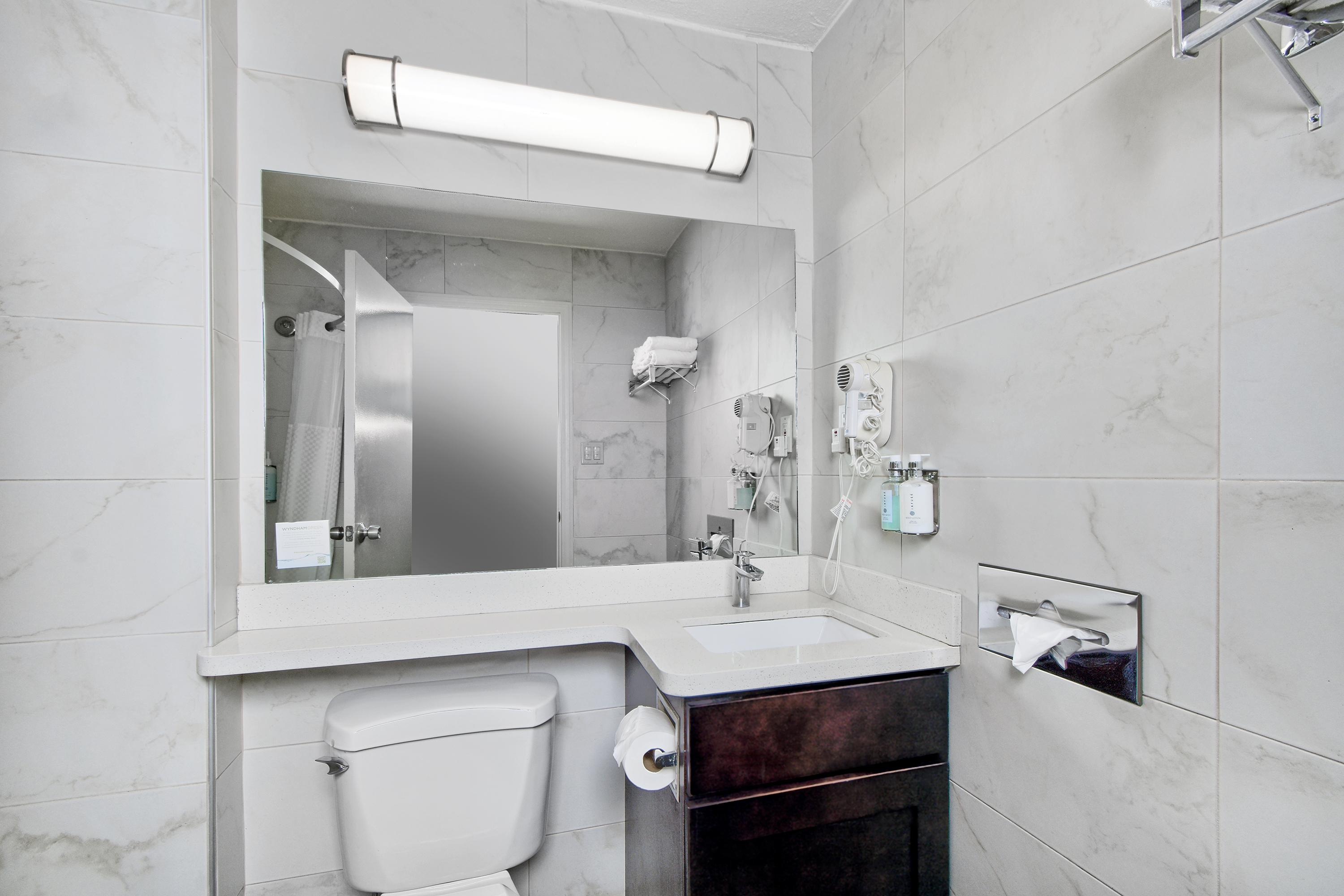 Guest room bath at the Days Inn by Wyndham Novato/San Francisco in Novato, California