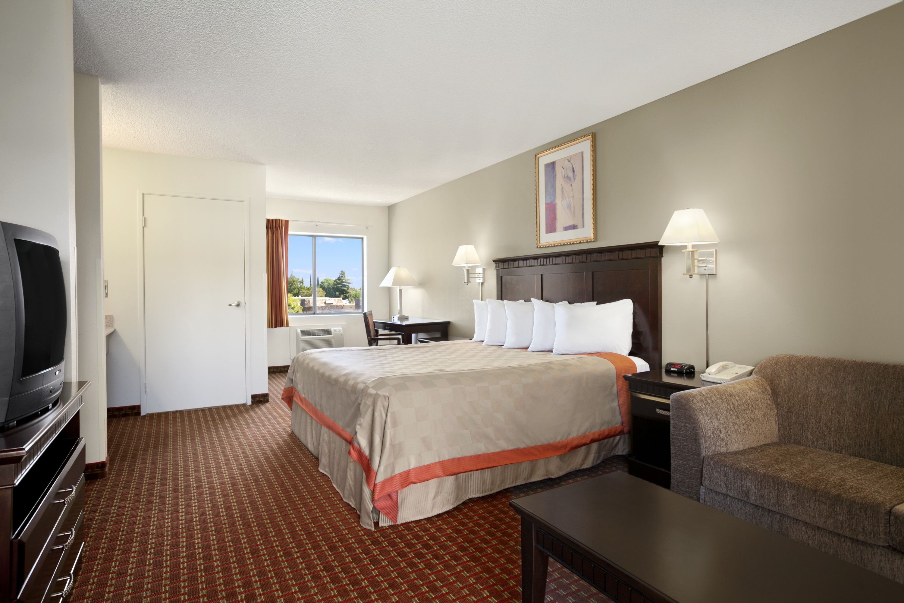 Guest room at the Days Inn & Suites by Wyndham Rancho Cordova in Rancho Cordova, California