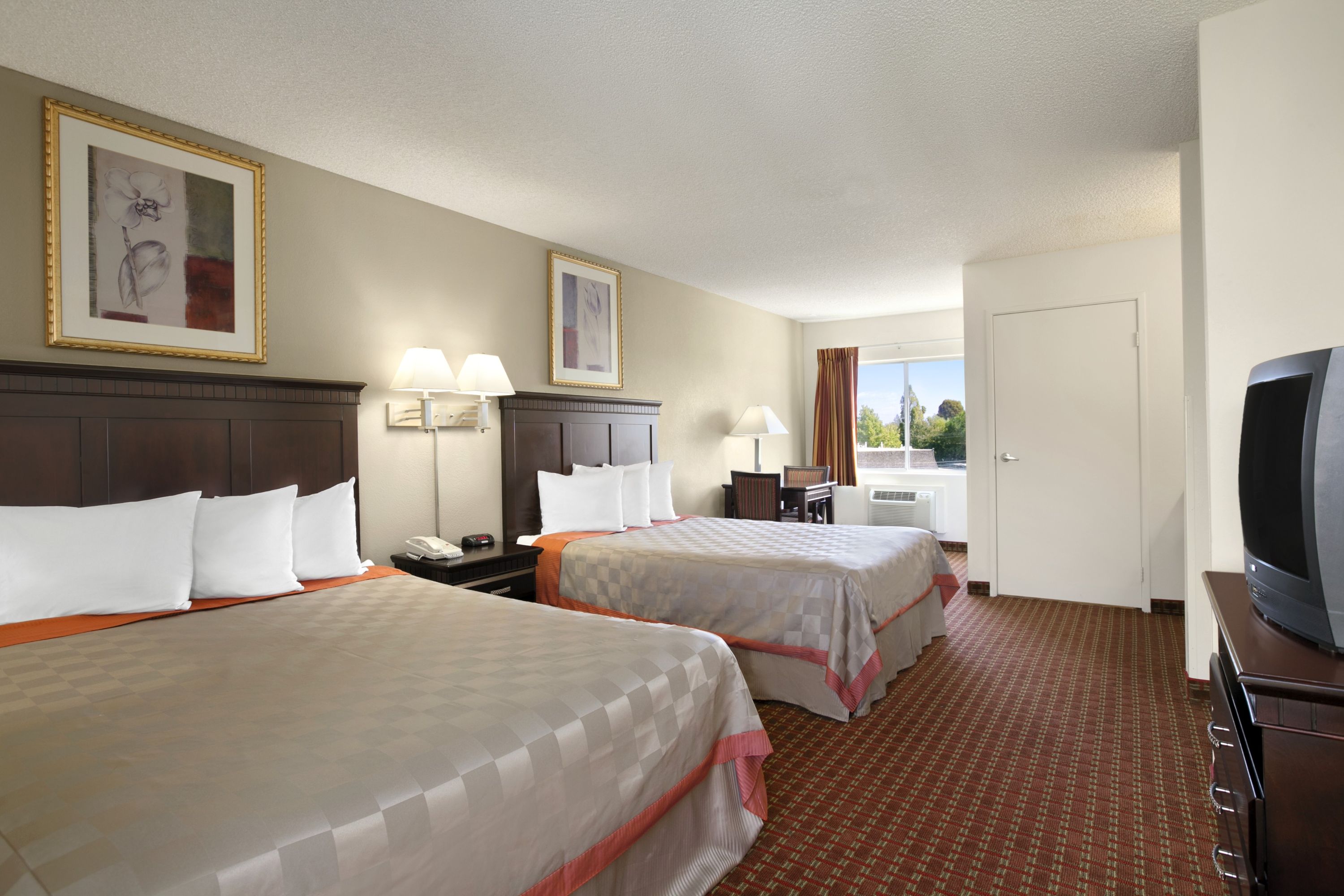 Guest room at the Days Inn & Suites by Wyndham Rancho Cordova in Rancho Cordova, California