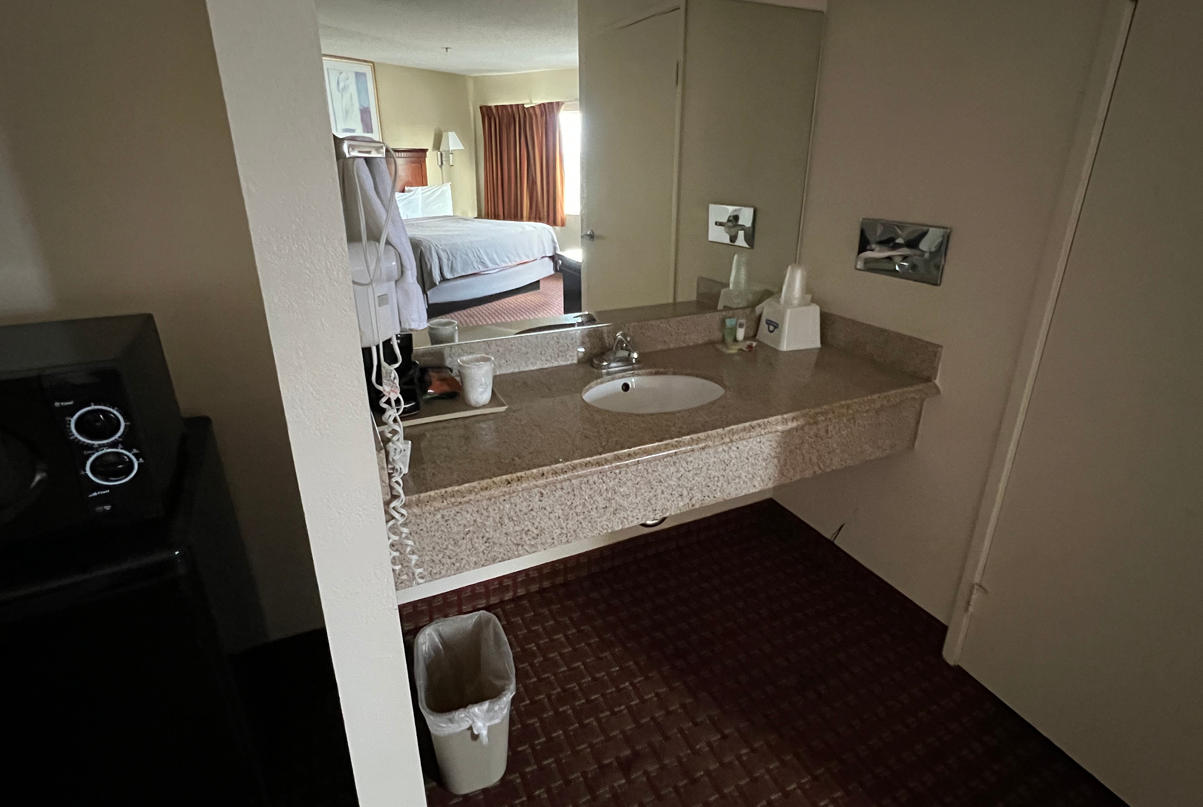 Guest room bath at the Days Inn & Suites by Wyndham Rancho Cordova in Rancho Cordova, California