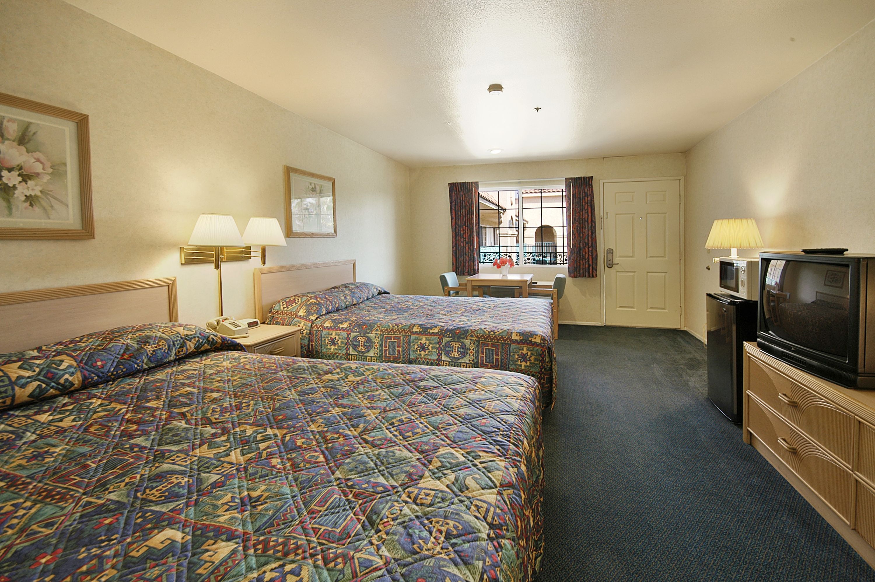 Guest room at the Days Inn by Wyndham Riverside Tyler Mall in Riverside, California