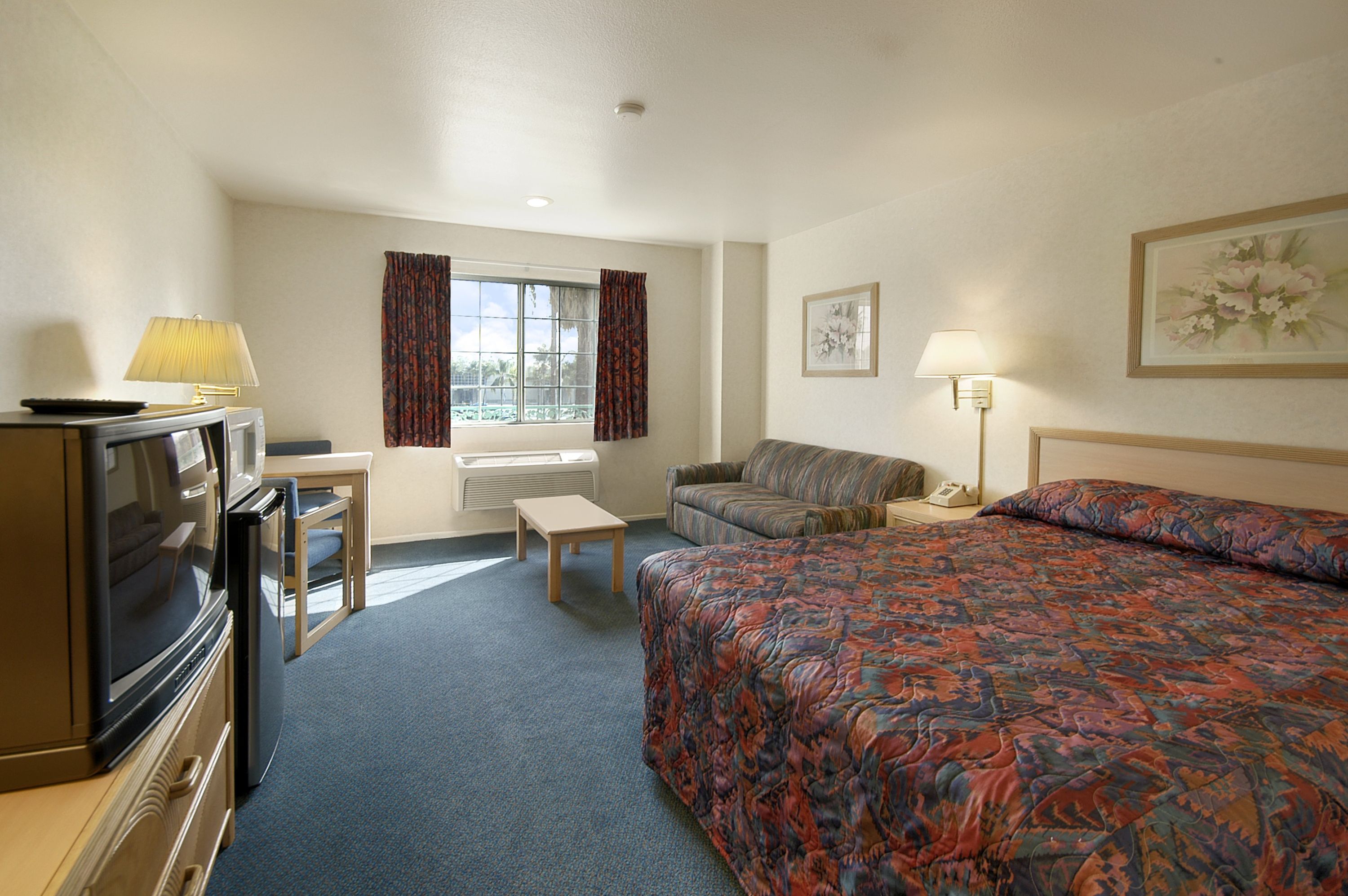 Guest room at the Days Inn by Wyndham Riverside Tyler Mall in Riverside, California
