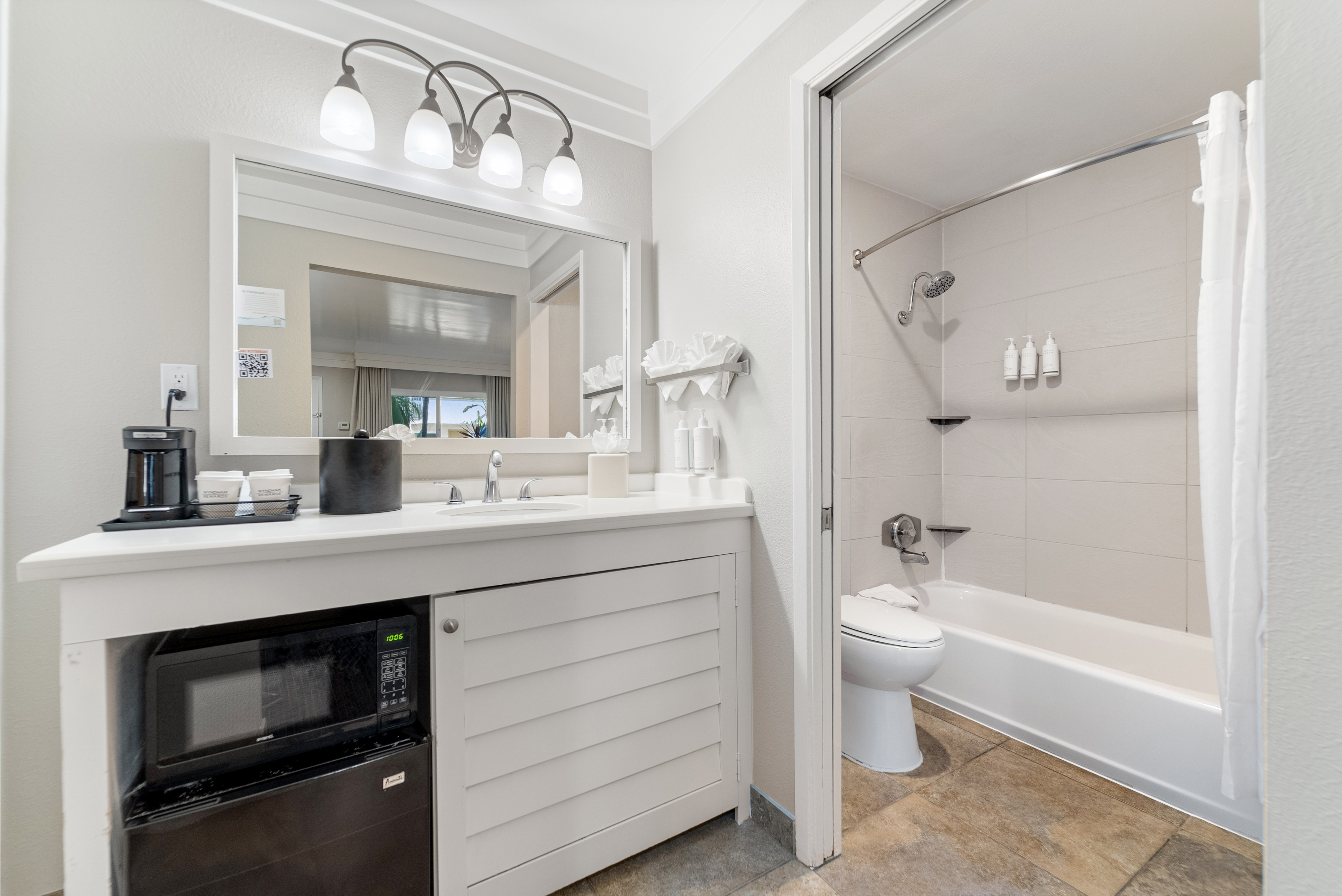 Guest room bath at the Days Inn by Wyndham San Diego Hotel Circle in San Diego, California