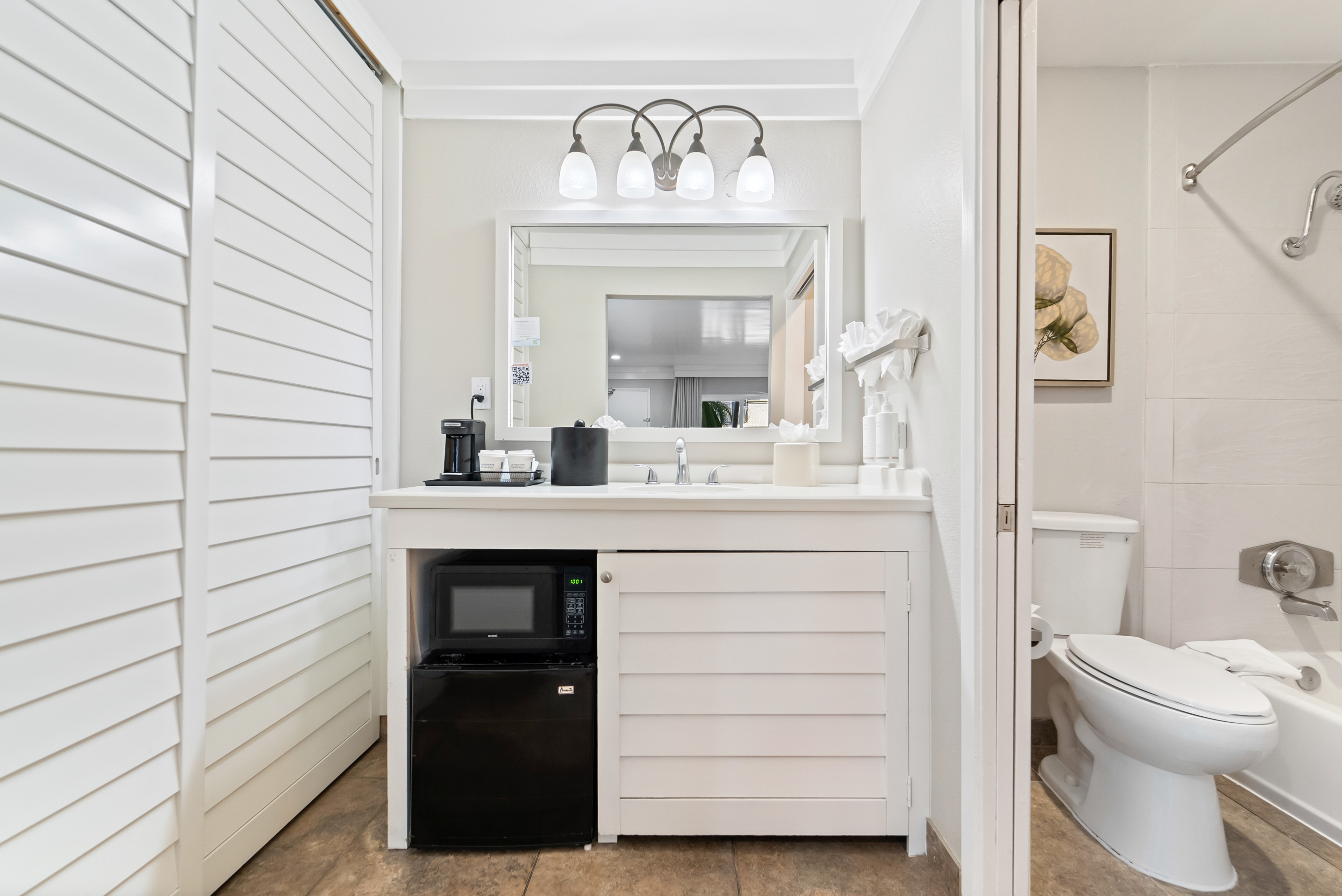 Guest room bath at the Days Inn by Wyndham San Diego Hotel Circle in San Diego, California