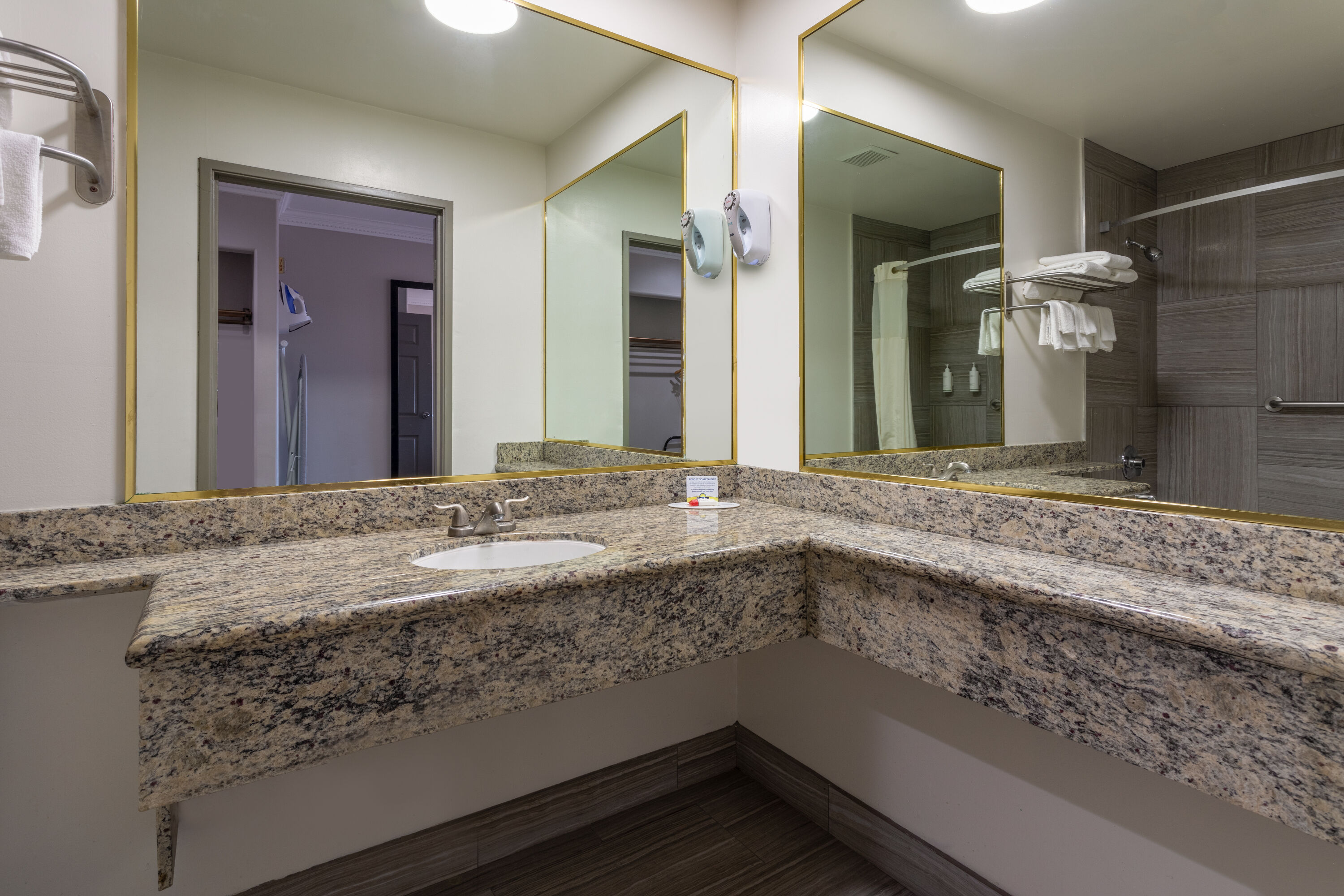 Guest room bath at the Days Inn by Wyndham Santa Monica in Santa Monica, California