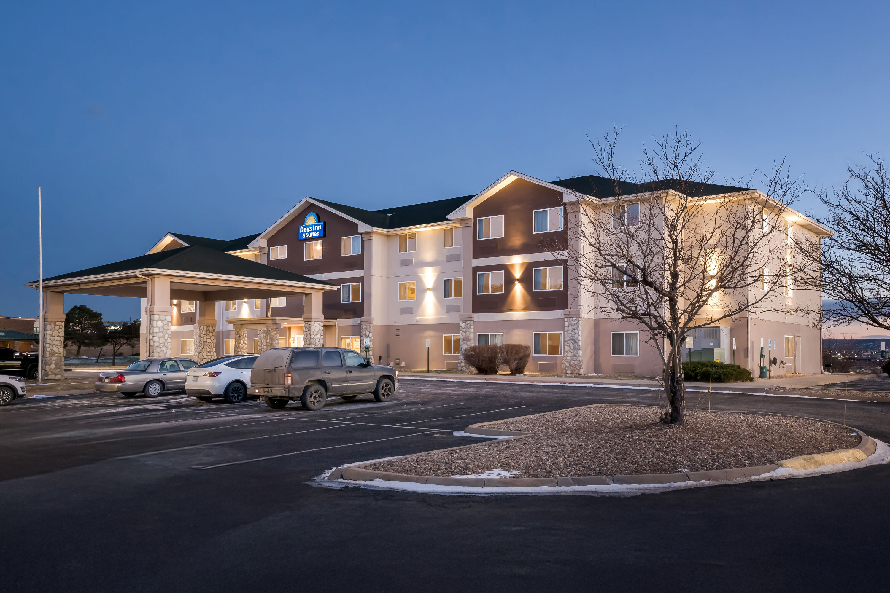 Exterior Night Image of Days Inn & Suites by Wyndham Castle Rock hotel in Castle Rock, Colorado