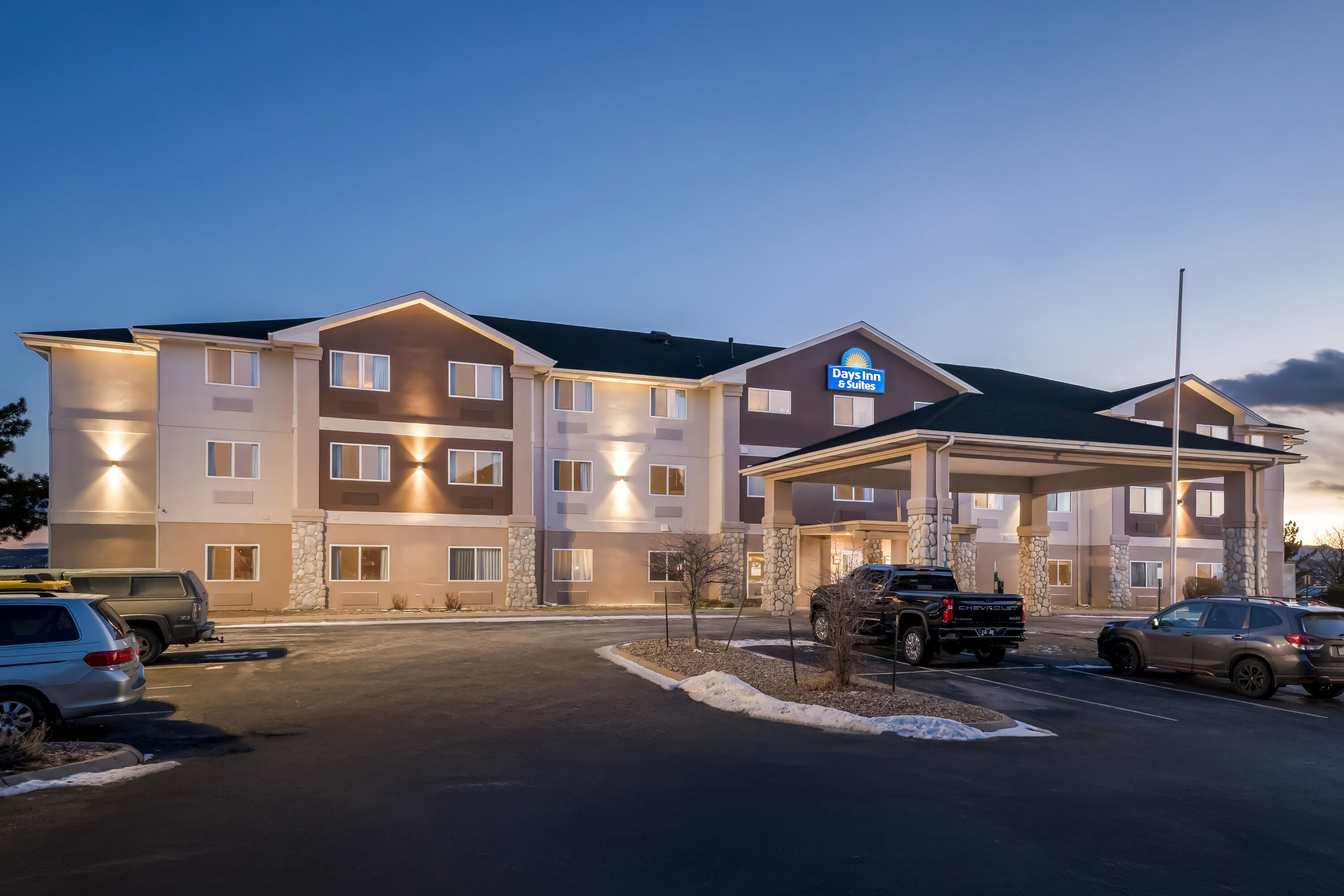 Exterior Night Image of Days Inn & Suites by Wyndham Castle Rock hotel in Castle Rock, Colorado