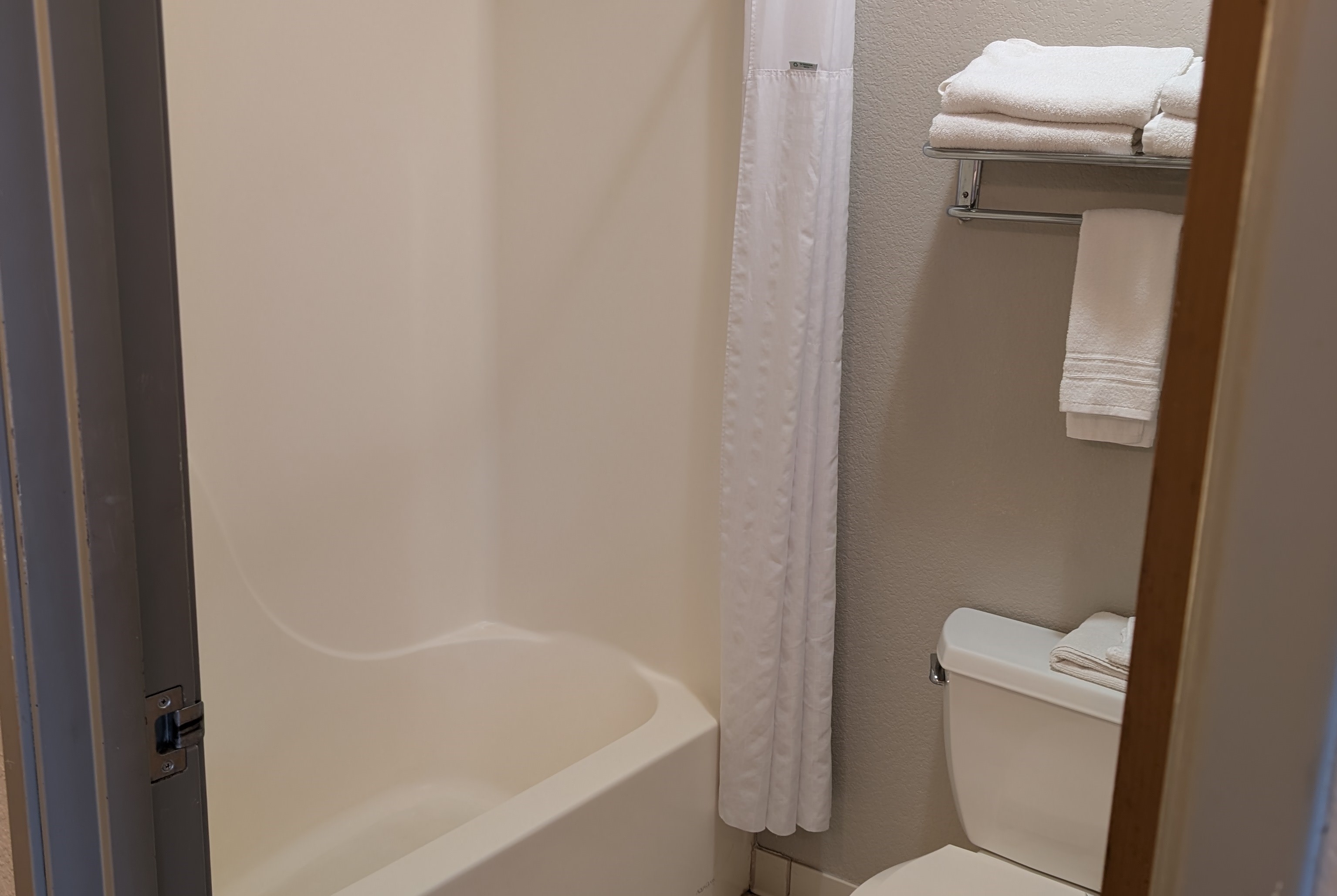 Guest room bath at the Days Inn & Suites by Wyndham Castle Rock in Castle Rock, Colorado
