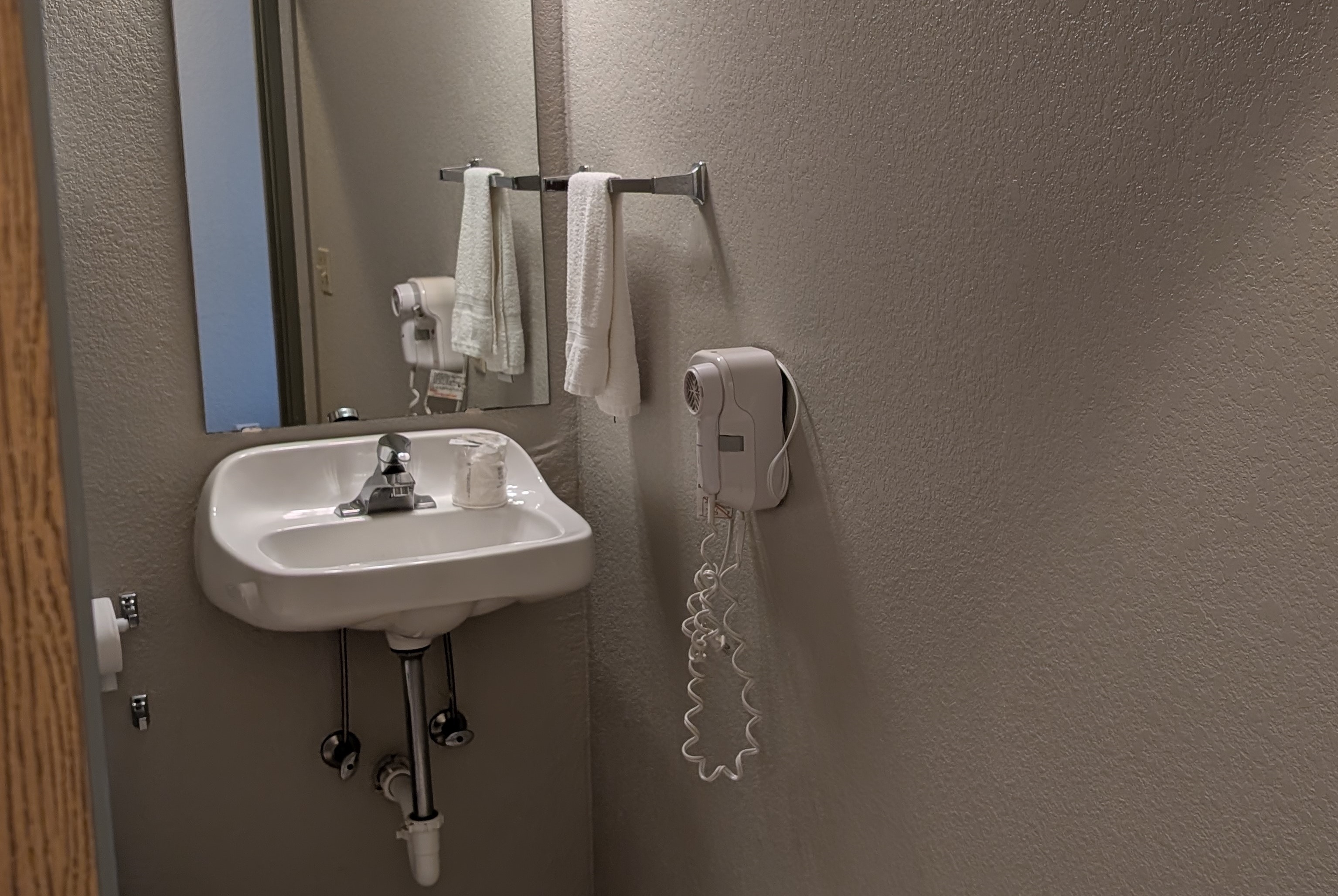 Guest room bath at the Days Inn & Suites by Wyndham Castle Rock in Castle Rock, Colorado