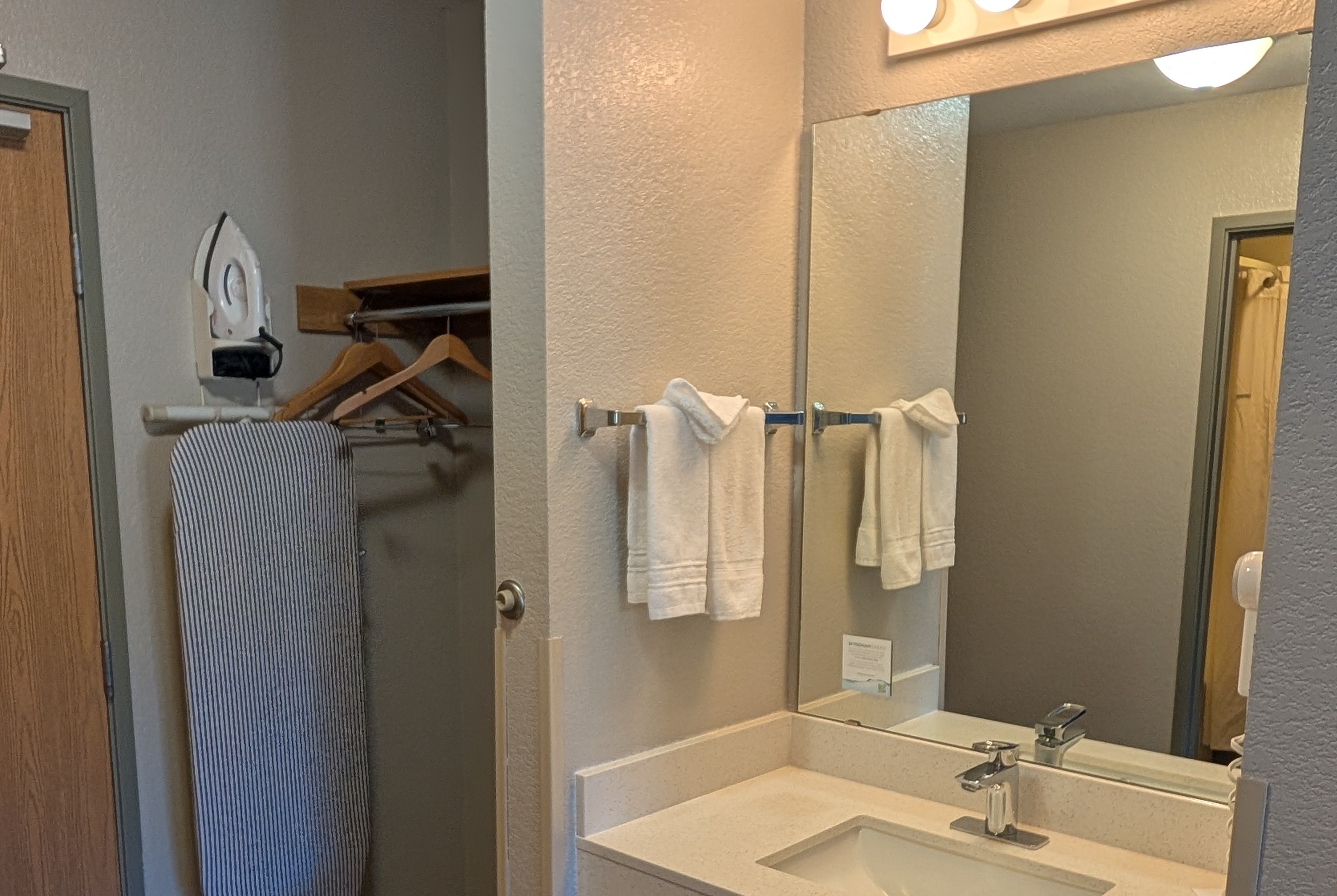 Guest room bath at the Days Inn & Suites by Wyndham Castle Rock in Castle Rock, Colorado