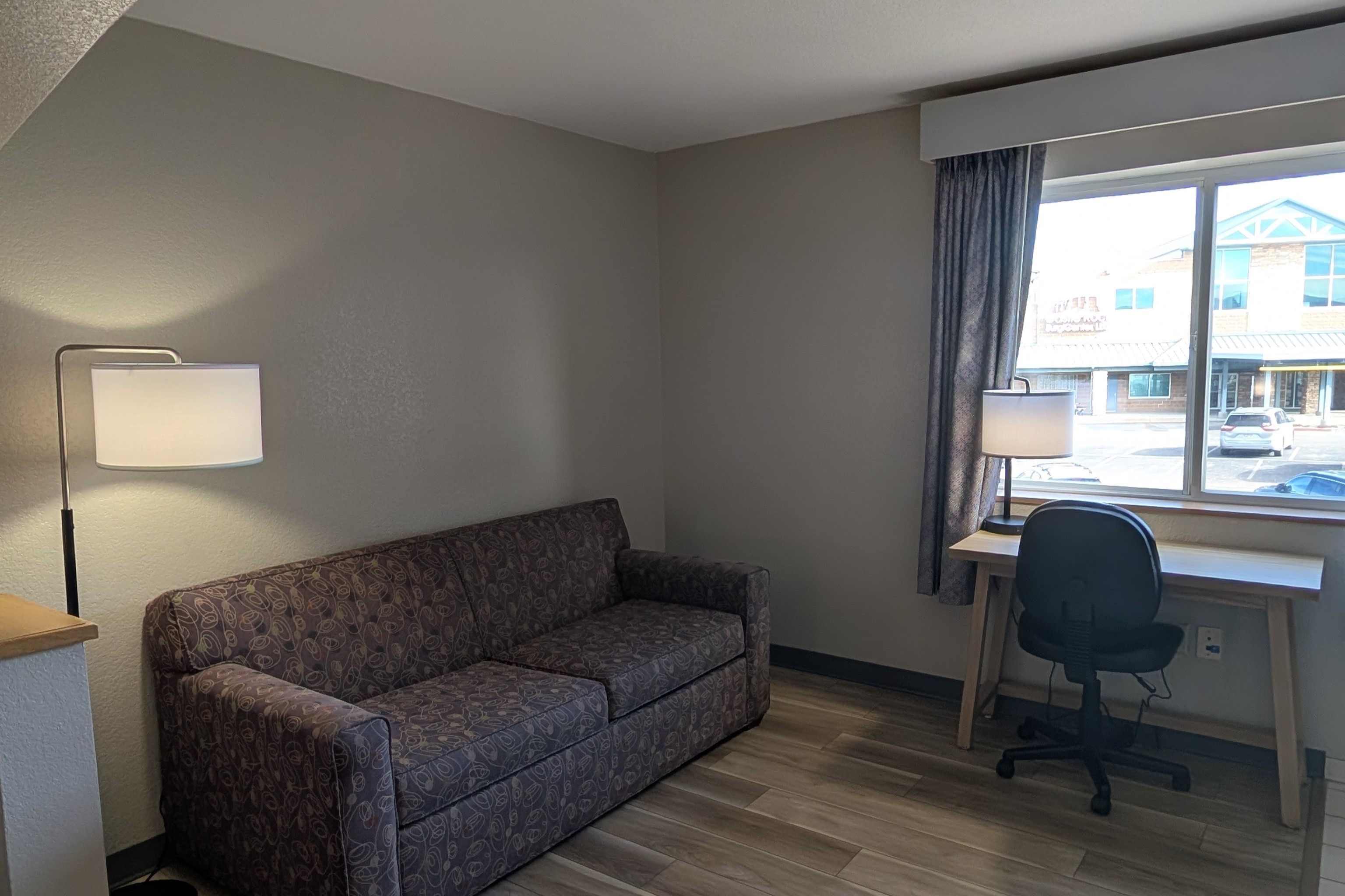 Guest room at the Days Inn & Suites by Wyndham Castle Rock in Castle Rock, Colorado