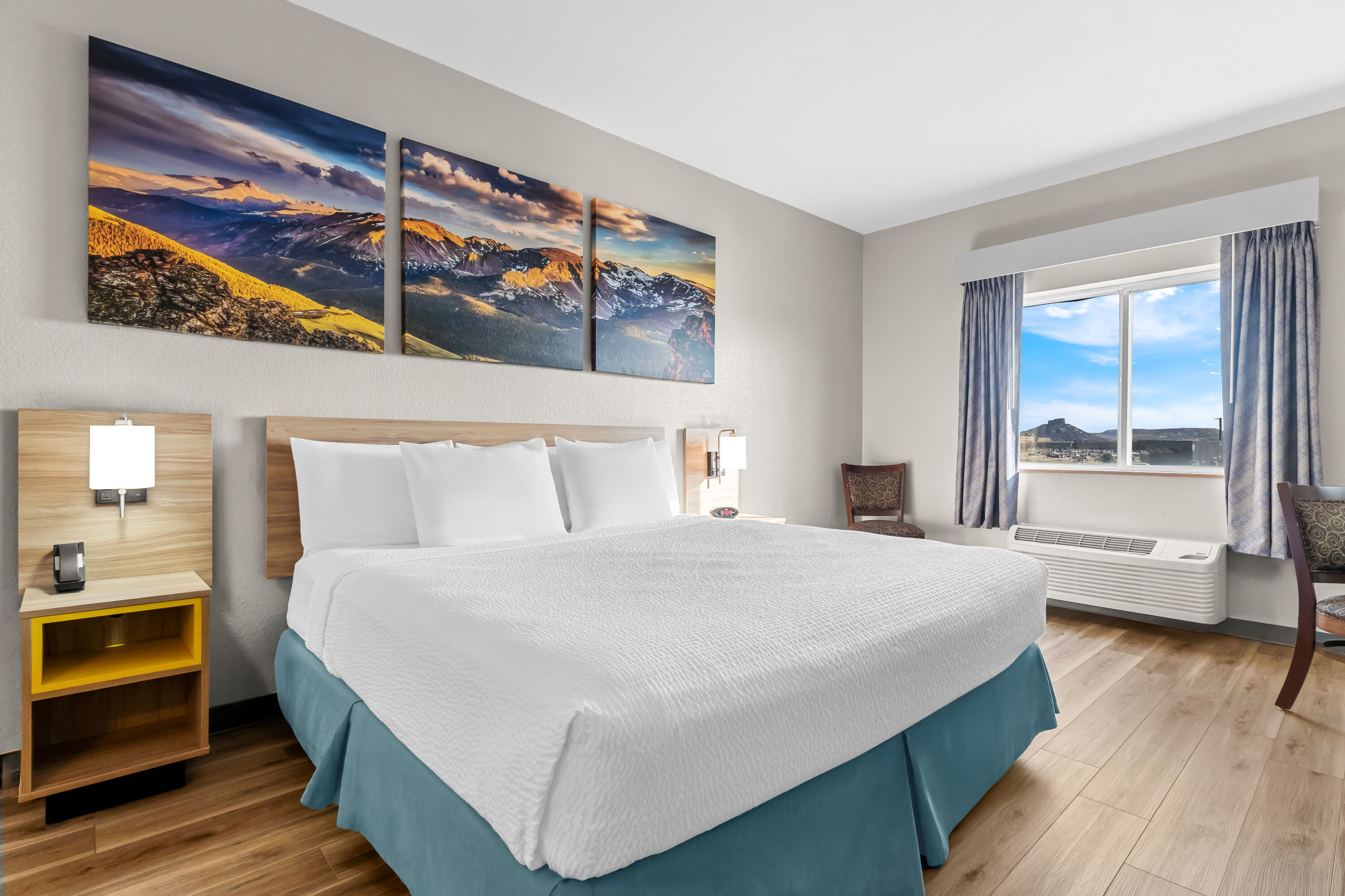 King bed guest room at the Days Inn & Suites by Wyndham Castle Rock in Castle Rock, Colorado