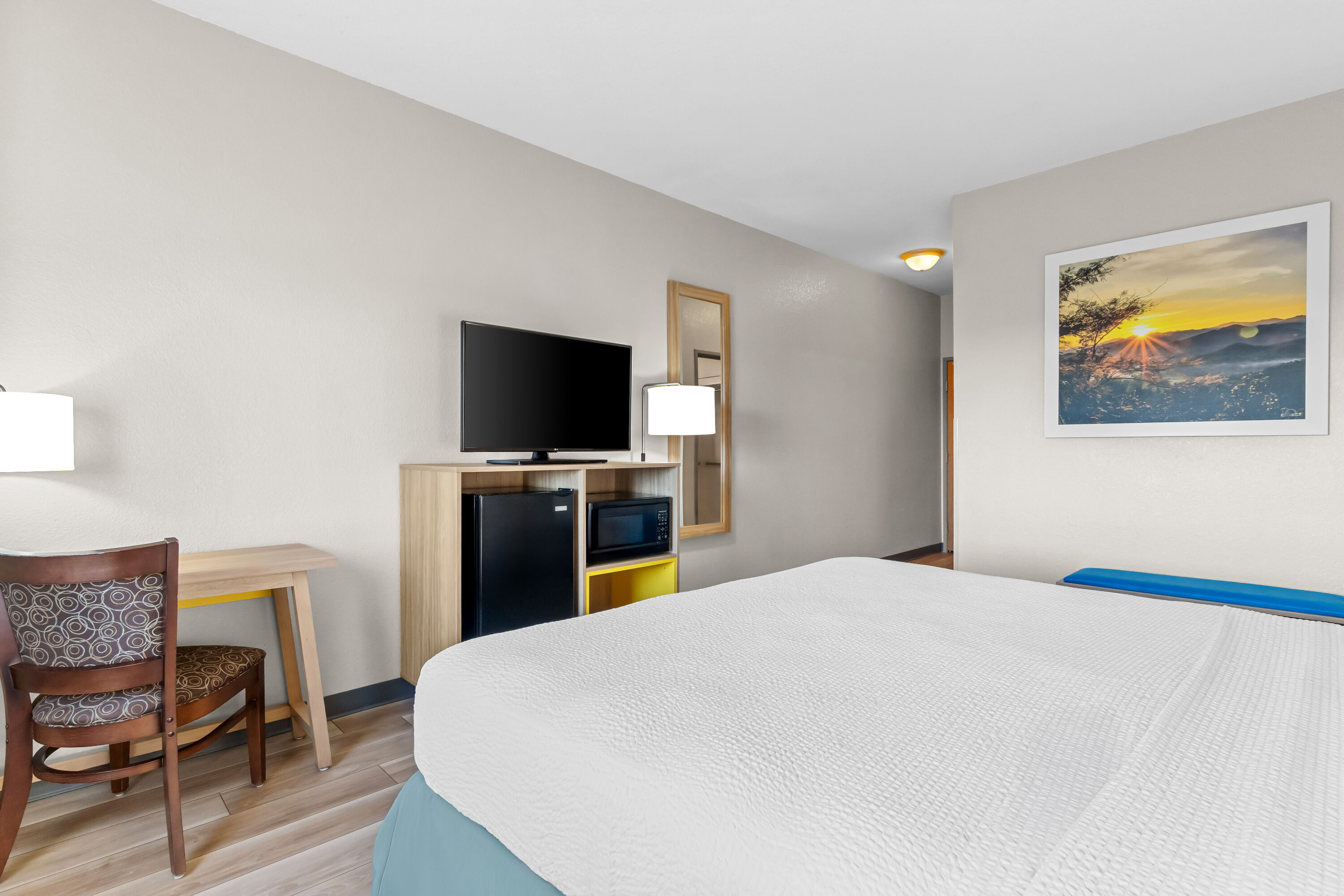 King bed guest room at the Days Inn & Suites by Wyndham Castle Rock in Castle Rock, Colorado