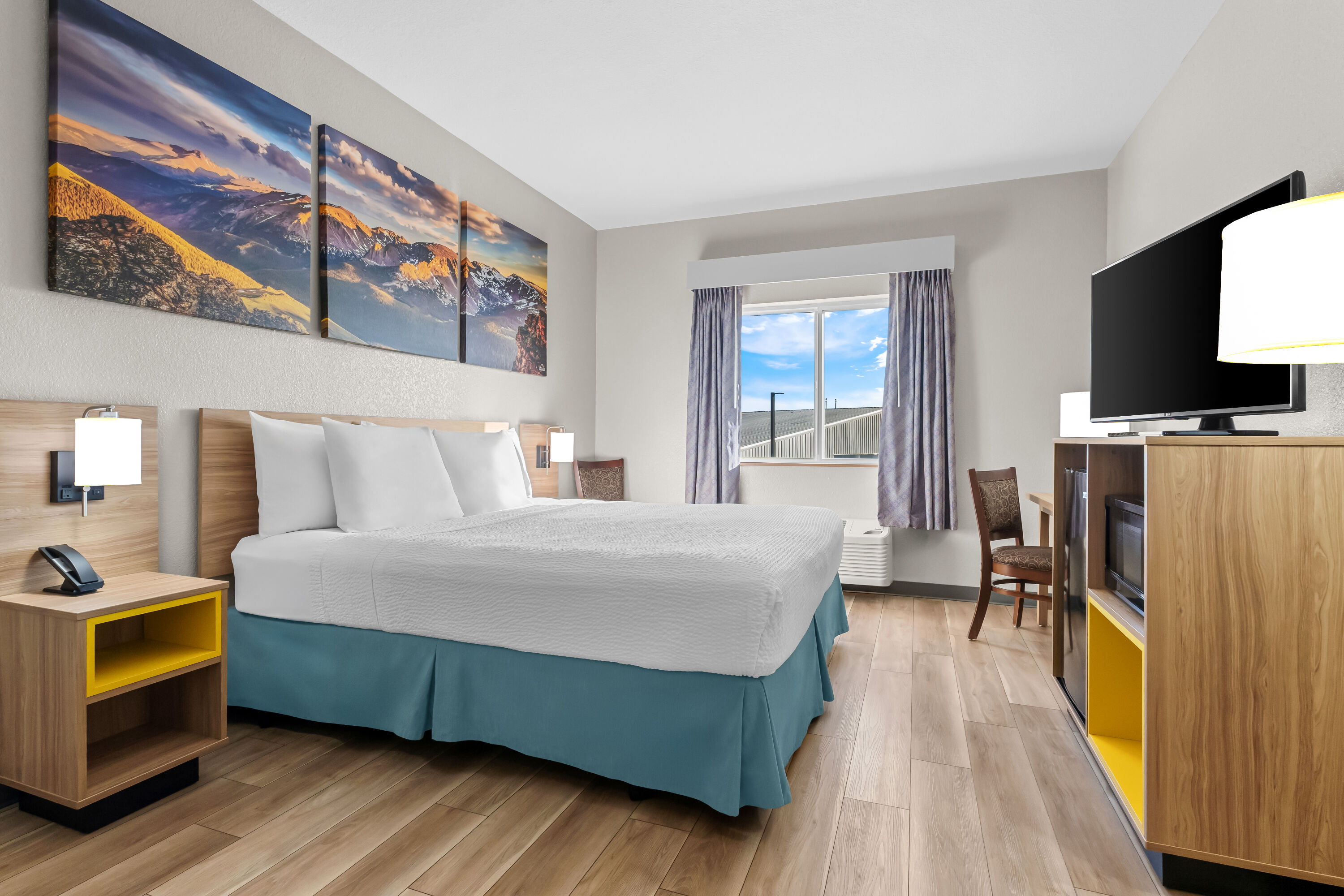 King bed guest room at the Days Inn & Suites by Wyndham Castle Rock in Castle Rock, Colorado