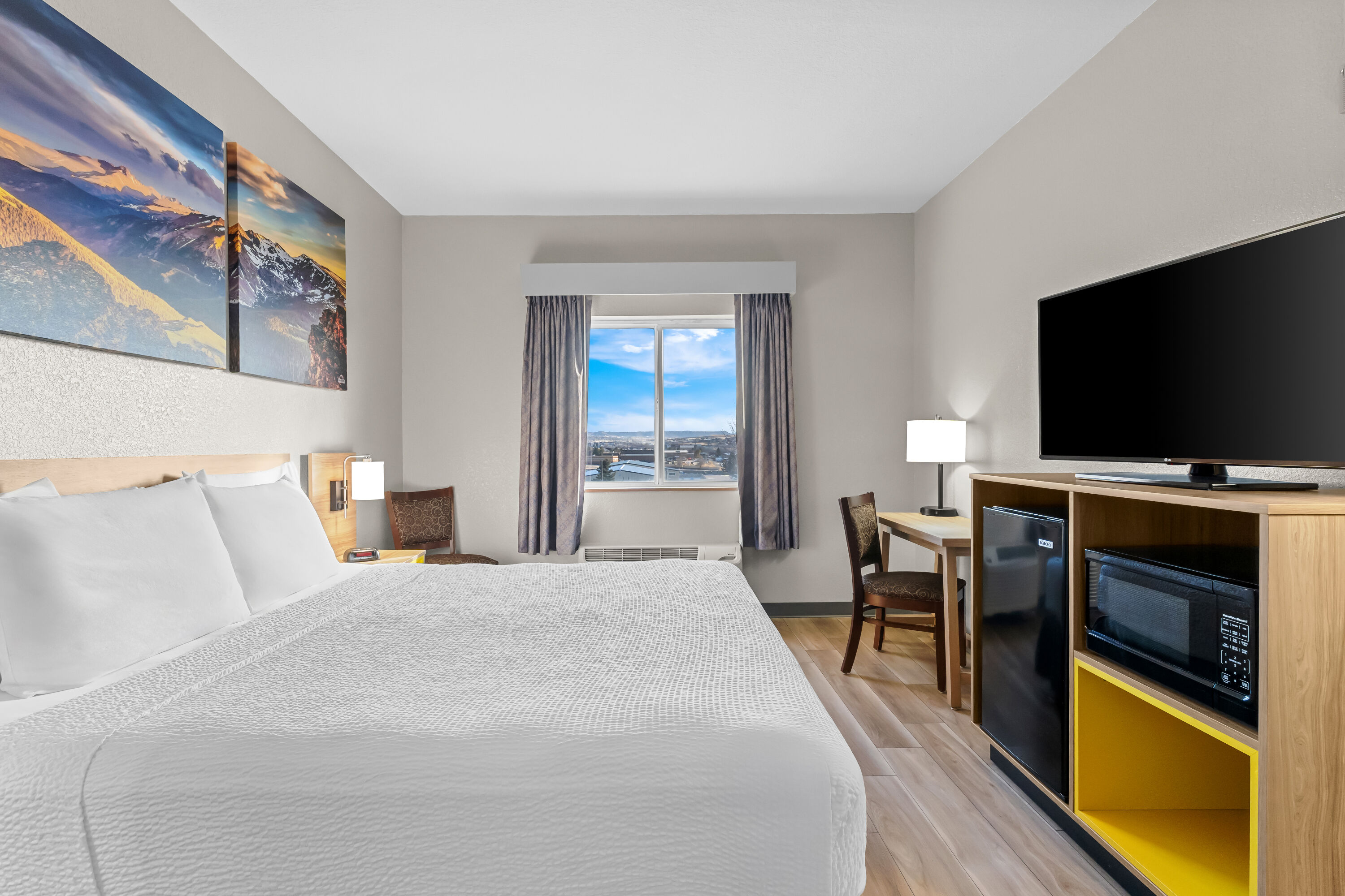 King bed guest room at the Days Inn & Suites by Wyndham Castle Rock in Castle Rock, Colorado