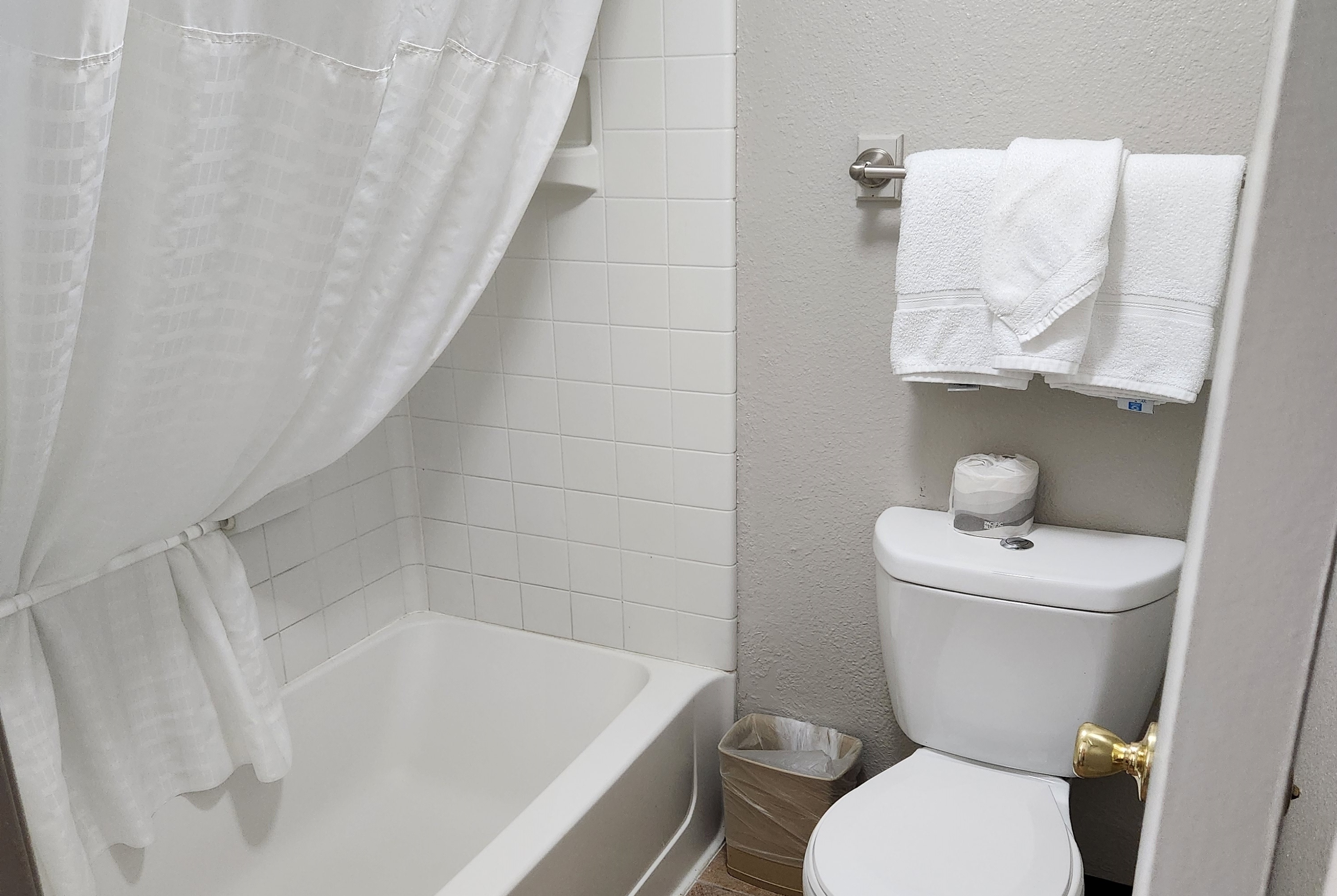 Guest room bath at the Days Inn by Wyndham Denver Downtown in Denver, Colorado
