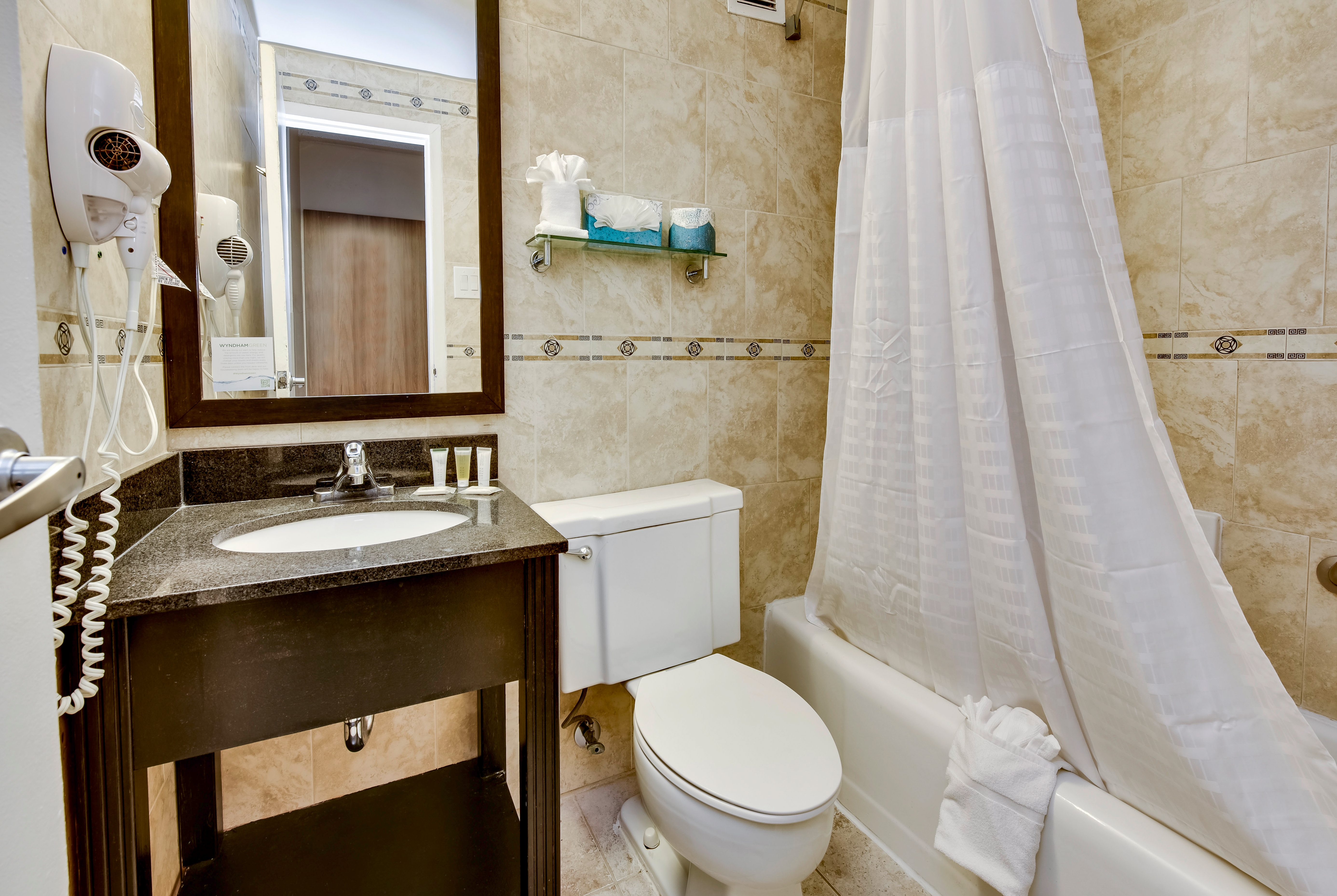 Guest room bath at the Days Inn by Wyndham Washington DC/Connecticut Avenue in Washington, District Of Columbia