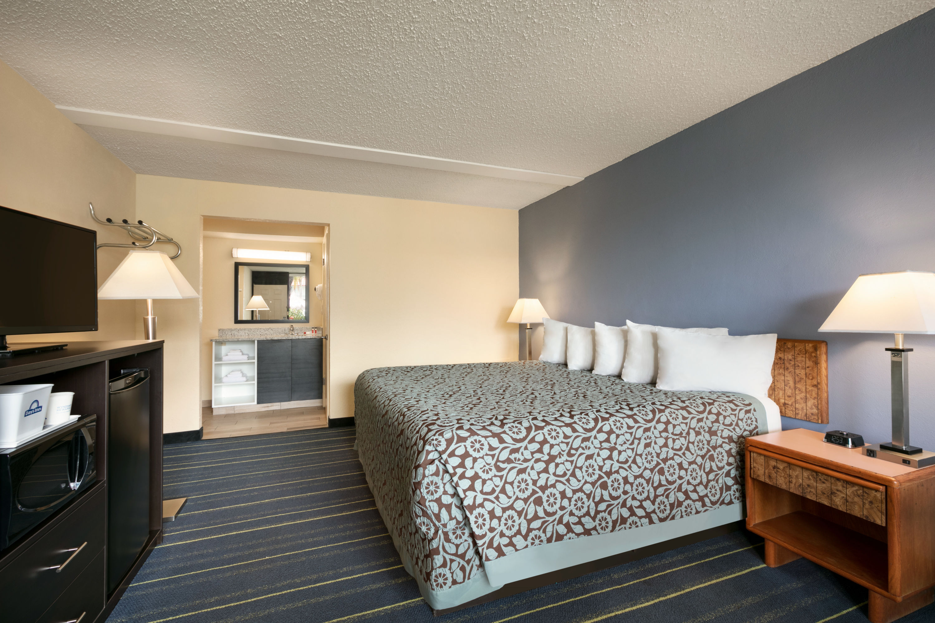 Guest room at the Days Inn by Wyndham Clearwater/Gulf to Bay in Clearwater, Florida