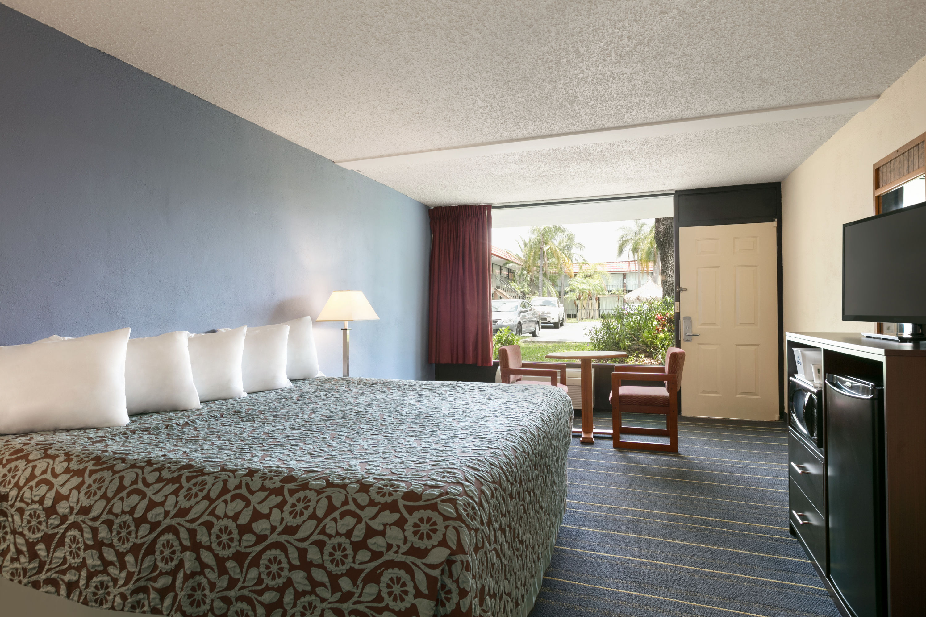 Guest room at the Days Inn by Wyndham Clearwater/Gulf to Bay in Clearwater, Florida
