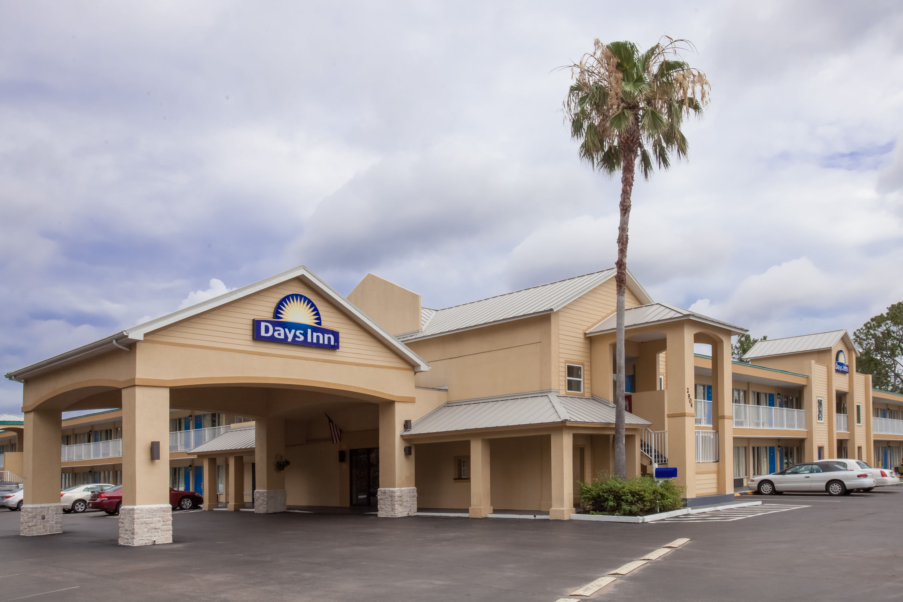 Exterior Day Image of Days Inn by Wyndham Daytona Beach Speedway hotel in Daytona Beach, Florida